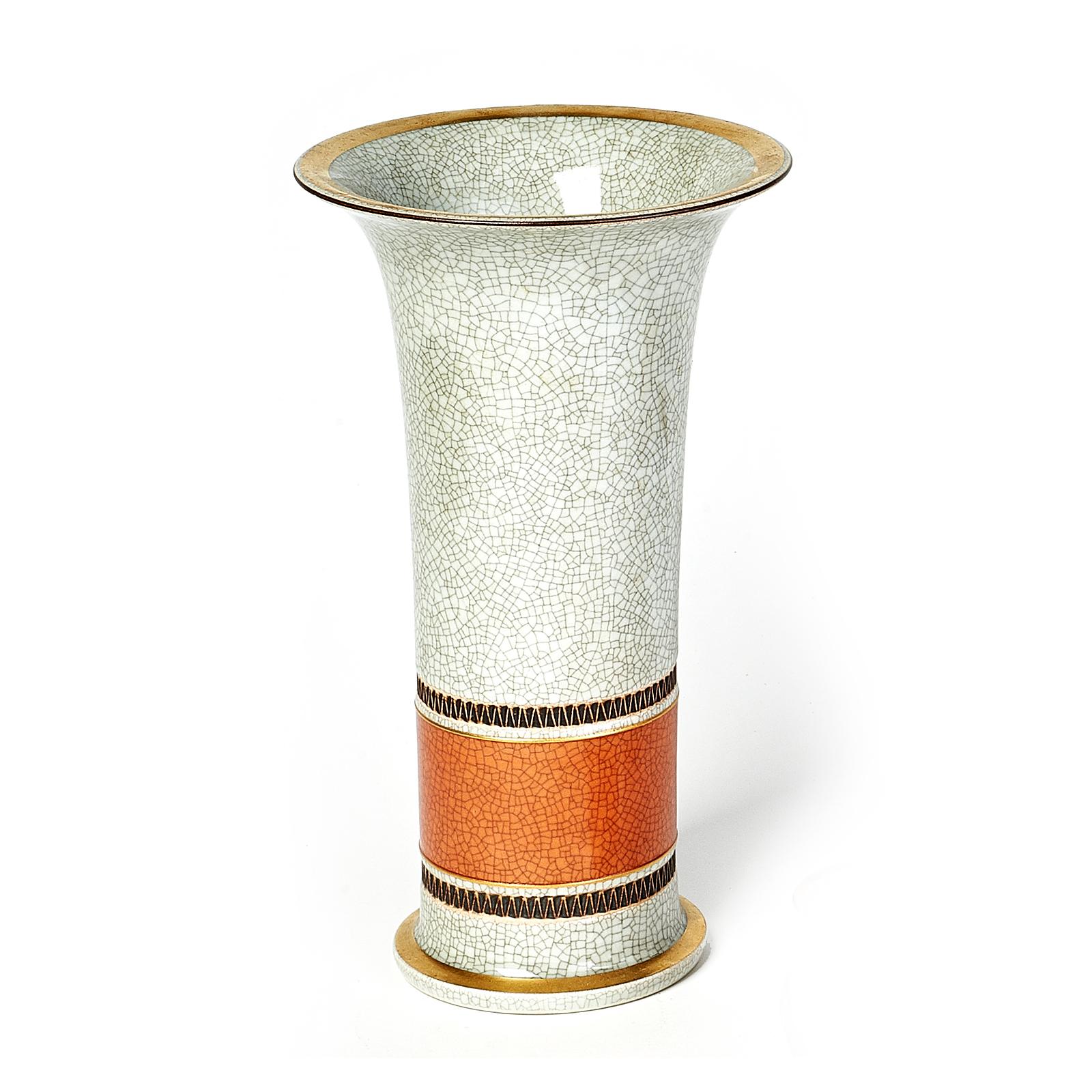 Royal Copenhagen
Trumpet shaped porcelain vase, terracotta and grey crackle glaze with gold decorative trim.
Marks on base. Denmark, 1950s
Dimensions: 9.5 height x 5.5 diameter.
   

 
    