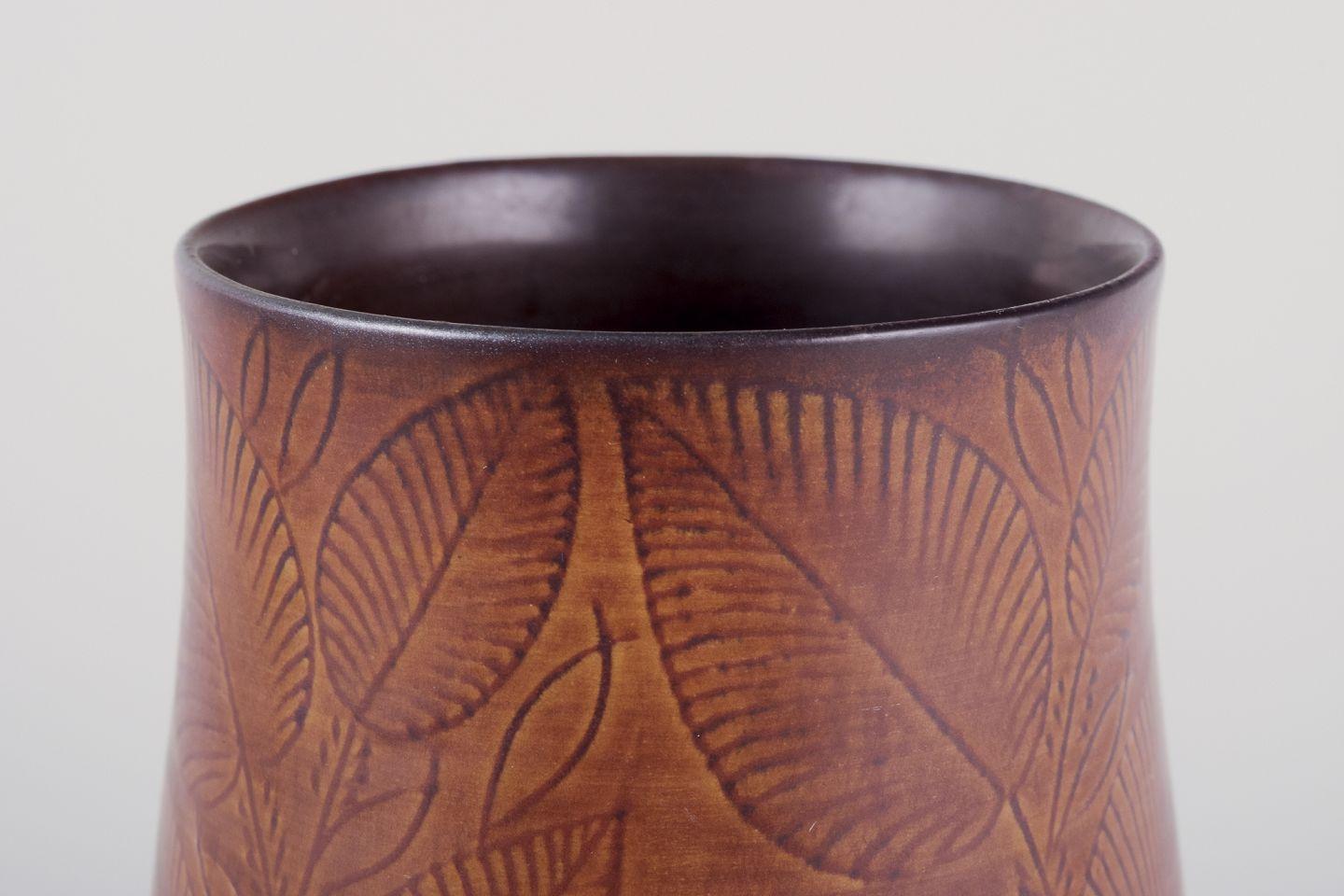 Danish Royal Copenhagen, vase in burnt red clay, decorated with foliage. For Sale