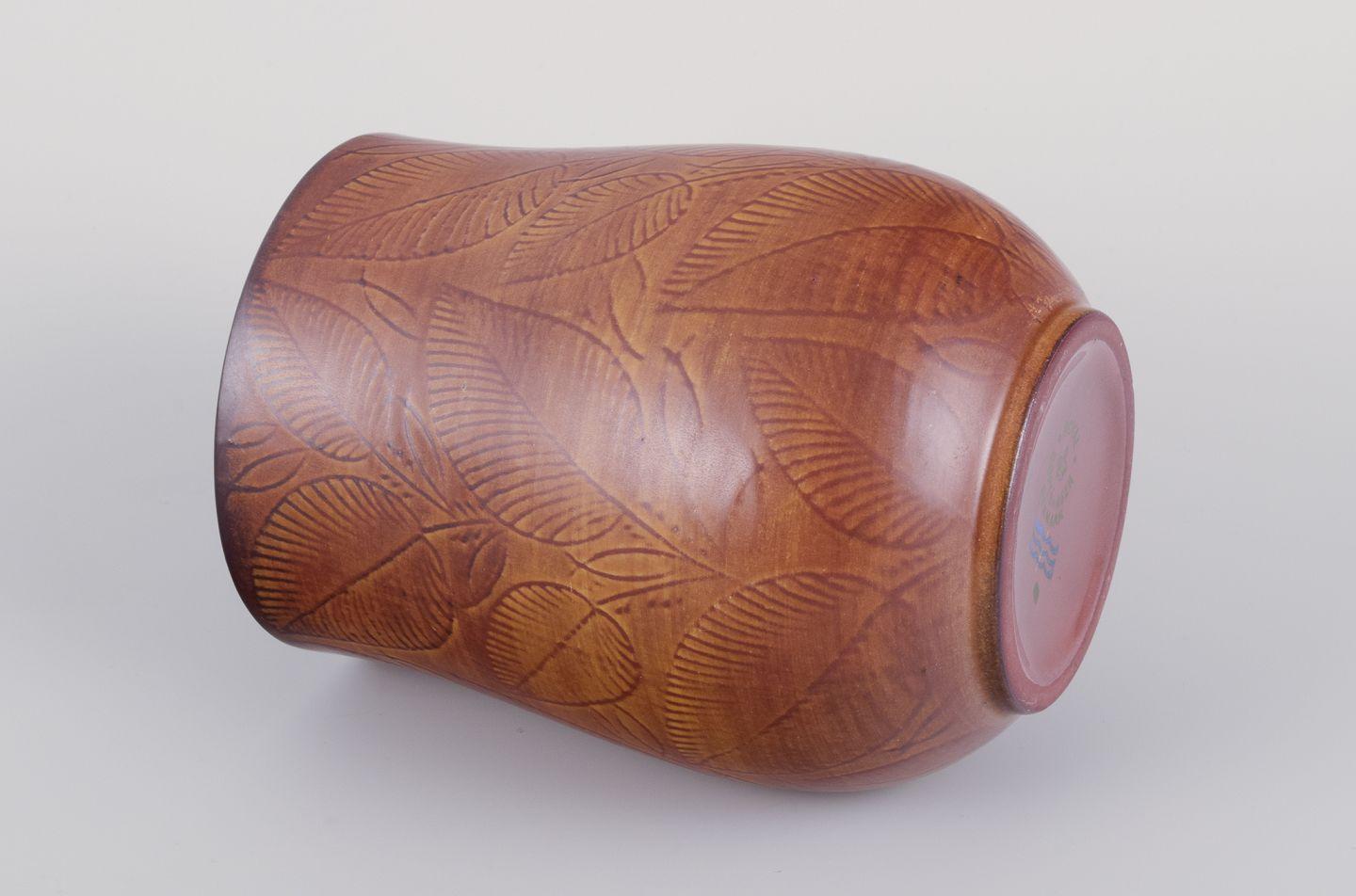 Mid-20th Century Royal Copenhagen, vase in burnt red clay, decorated with foliage. For Sale