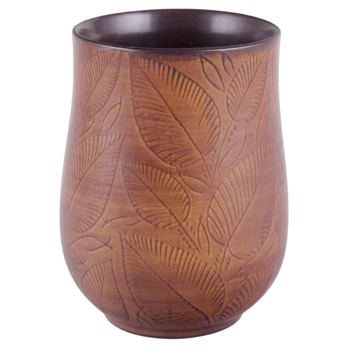 Royal Copenhagen, vase in burnt red clay, decorated with foliage. For Sale