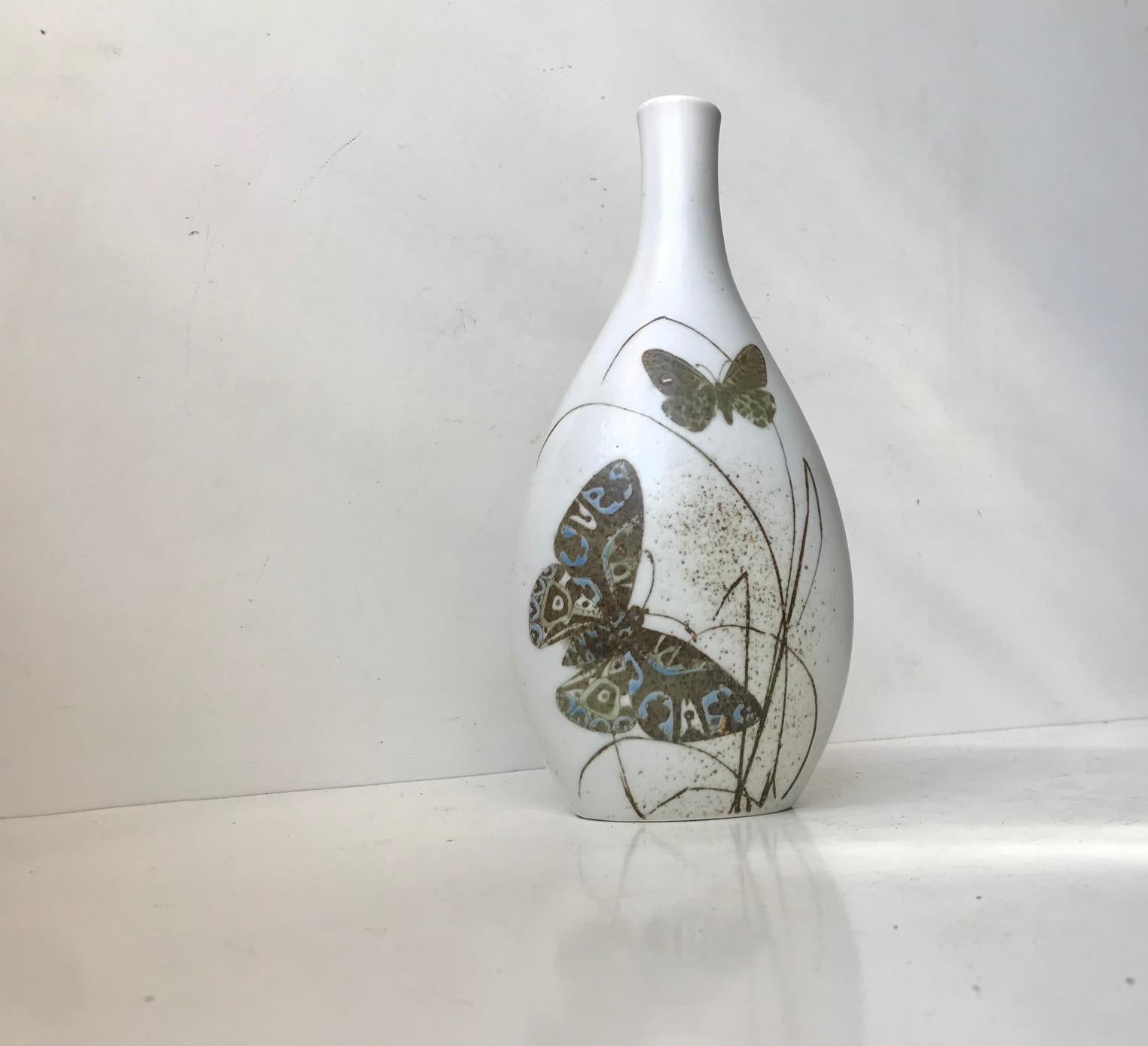Large Royal Copenhagen ceramic Vase designed by Nils Thorsson. Decorated in earthy glazes with butterflies and flowers. Model number 1044/5141 and its fully marked to the base with designer initials and makers mark. Measurements: H: 24, D: 13 cm.