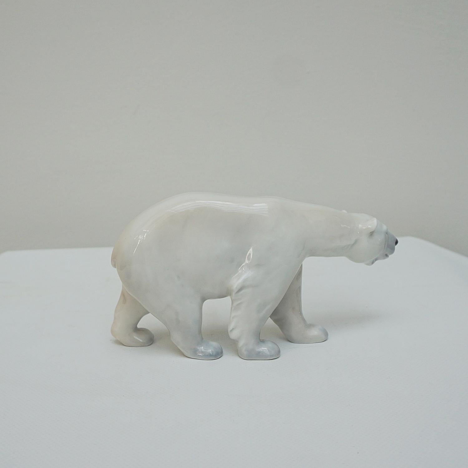 Royal Copenhagen Walking Polar Bear Figurine, 1st assortment, no. 320. Designed by Carl Johan Bonnesen.

Dimensions: H 10cm W 4cm D 19cm

Origin: Denmark

Date: 1900

Item Number: 1006232.