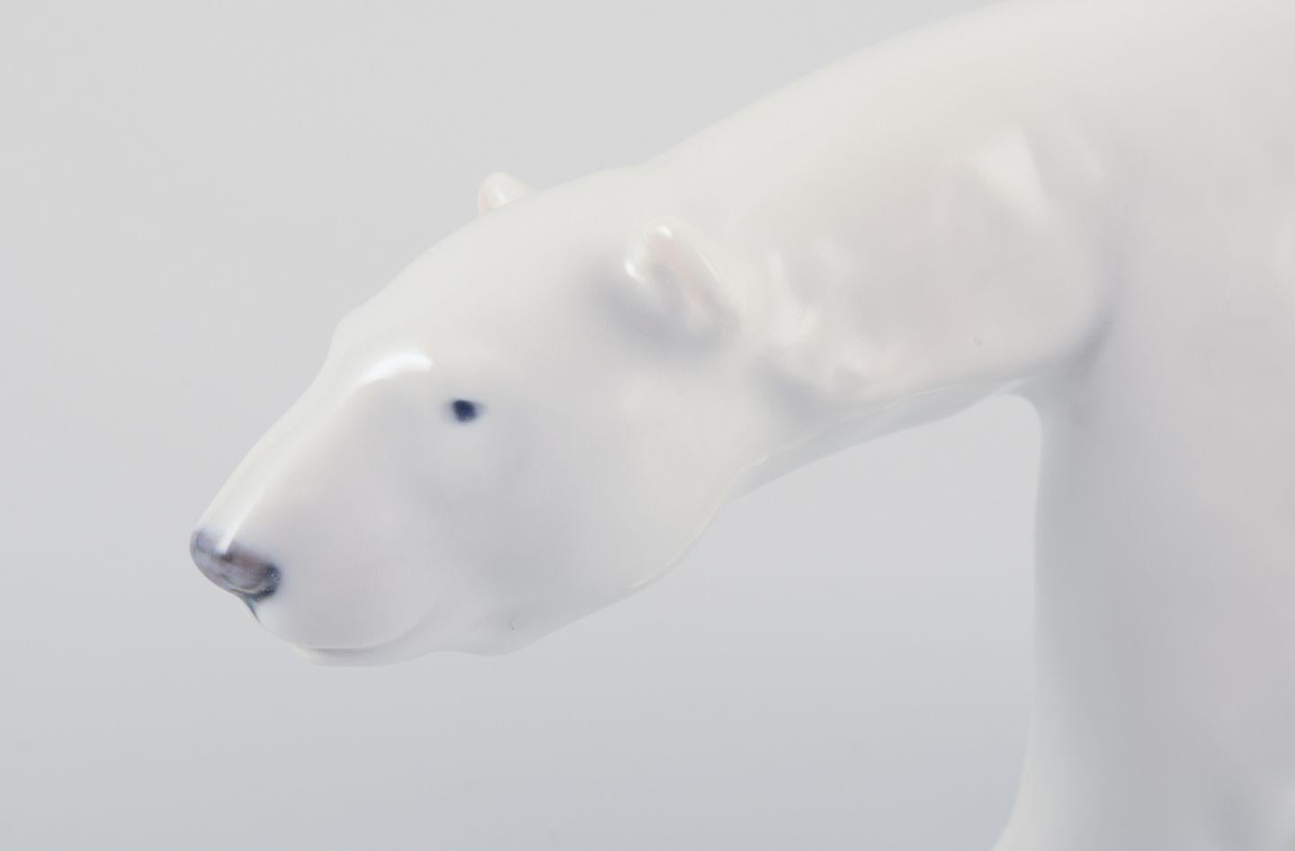 Danish Royal Copenhagen, walking polar bear figurine in porcelain. Approx. 1930 For Sale