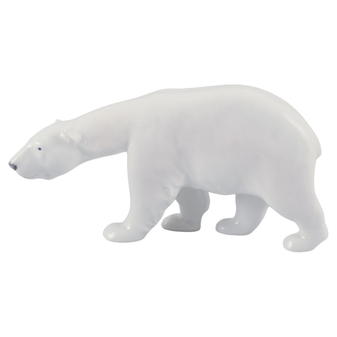 Royal Copenhagen, walking polar bear figurine in porcelain. Approx. 1930 For Sale