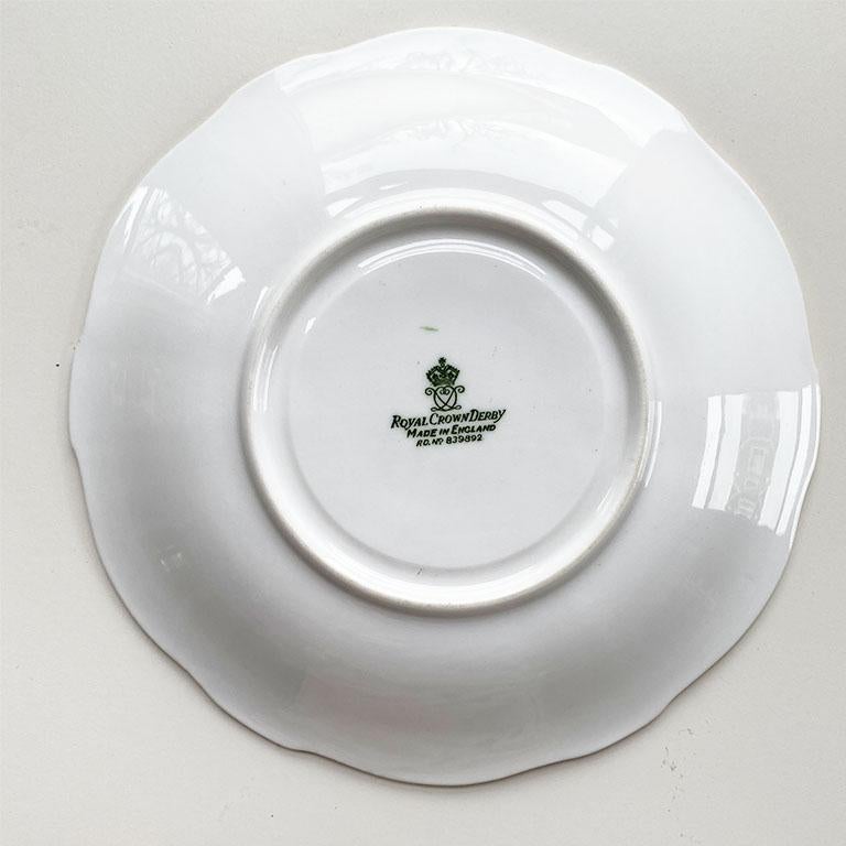 A lovely Royal Crown Derby saucer plate with a bird pattern and gold rim. Great for use at a dinner table, or as a small vide poche. 

Marked at bottom: 
Royal Crown Derby
Made in England
RD. NO. 839892

Dimensions:
6.25