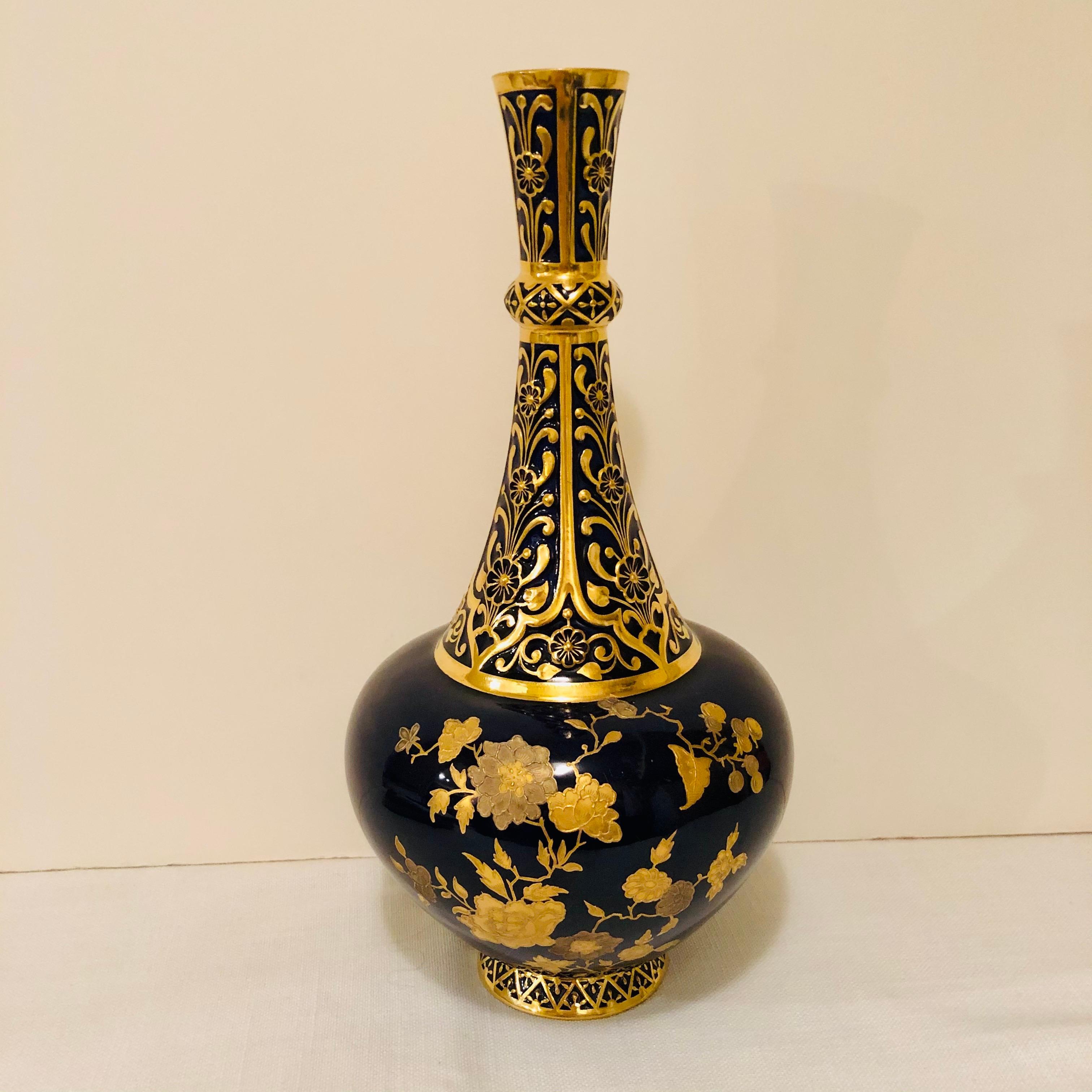 I want to offer you this beautiful Royal Crown Derby cobalt vase decorated with raised gilding. The neck of the vase has a raised intricate gold design as you can see in the pictures. The bulbous bottom is decorated with raised gilding, both dark