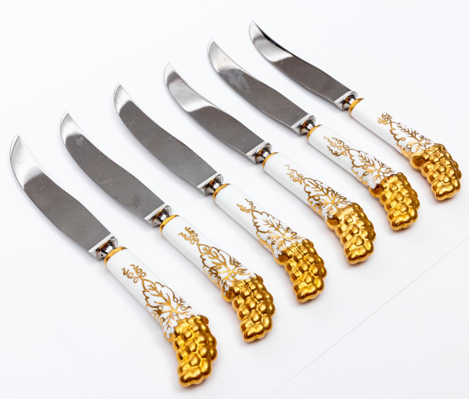 Circa 1950s Royal Crown Derby six knife set with gold grape designs and porcelain handles. Discontinued now. Never used. Made in England. Please note of wear consistent with age. 7.00 inch long knife.