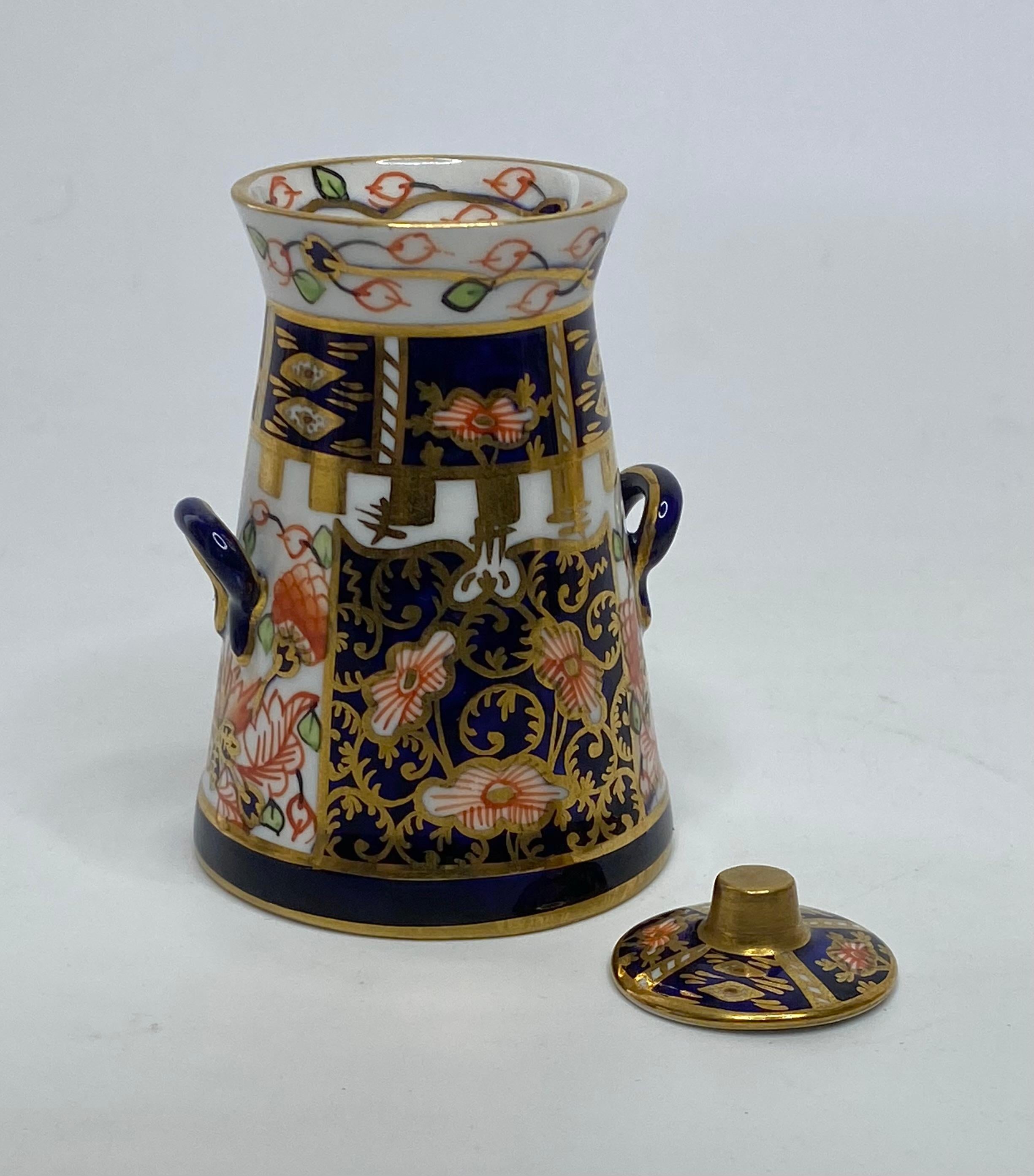 Royal Crown Derby miniature milk churn and cover, dated 1921. 1