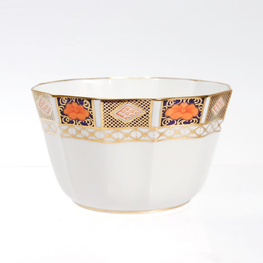 A fine Royal Crown Derby porcelain bowl.

In the Border Imari pattern (No. 8450)

The bowl with a scalloped rim, faceted walls, gilt highlights, and imari designs to the border.

Marked to the base with the red Royal Crown Derby maker's mark / 8450