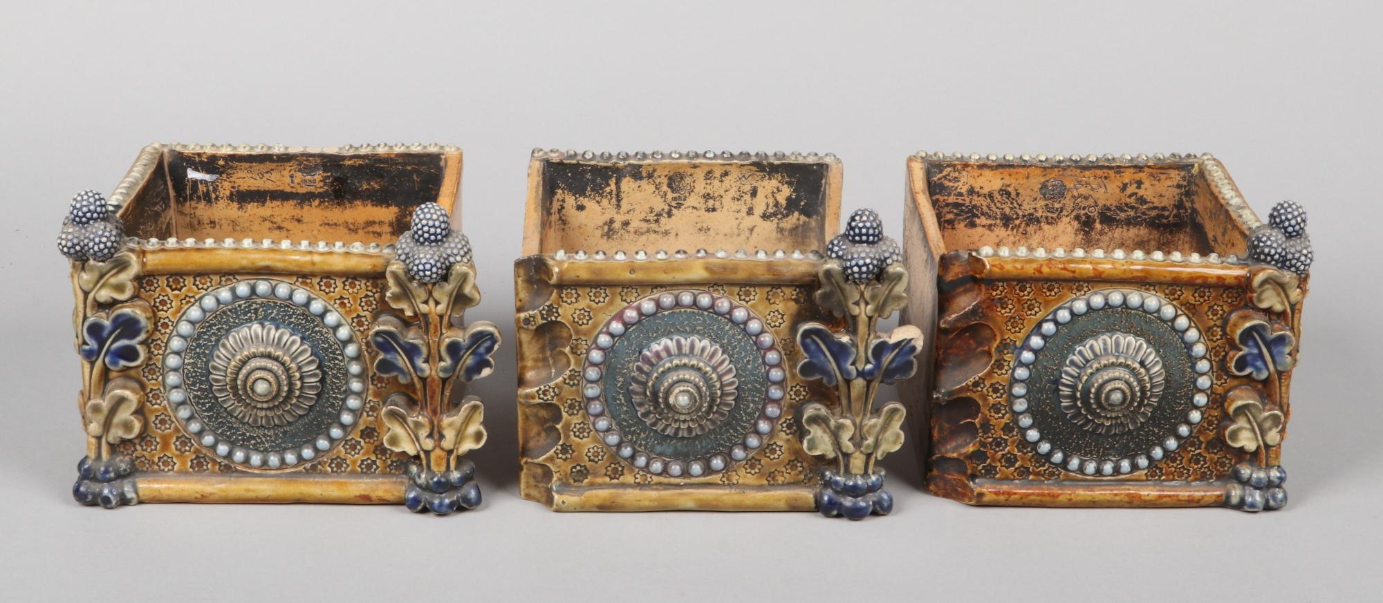Royal Doulton. Lambeth.
A rare Aesthetic Movement three-section window sill flower planter, with stylized floral beaded roundels to the front and incised floral roundels to each end, all with incised petite flower heads and foliate and berry