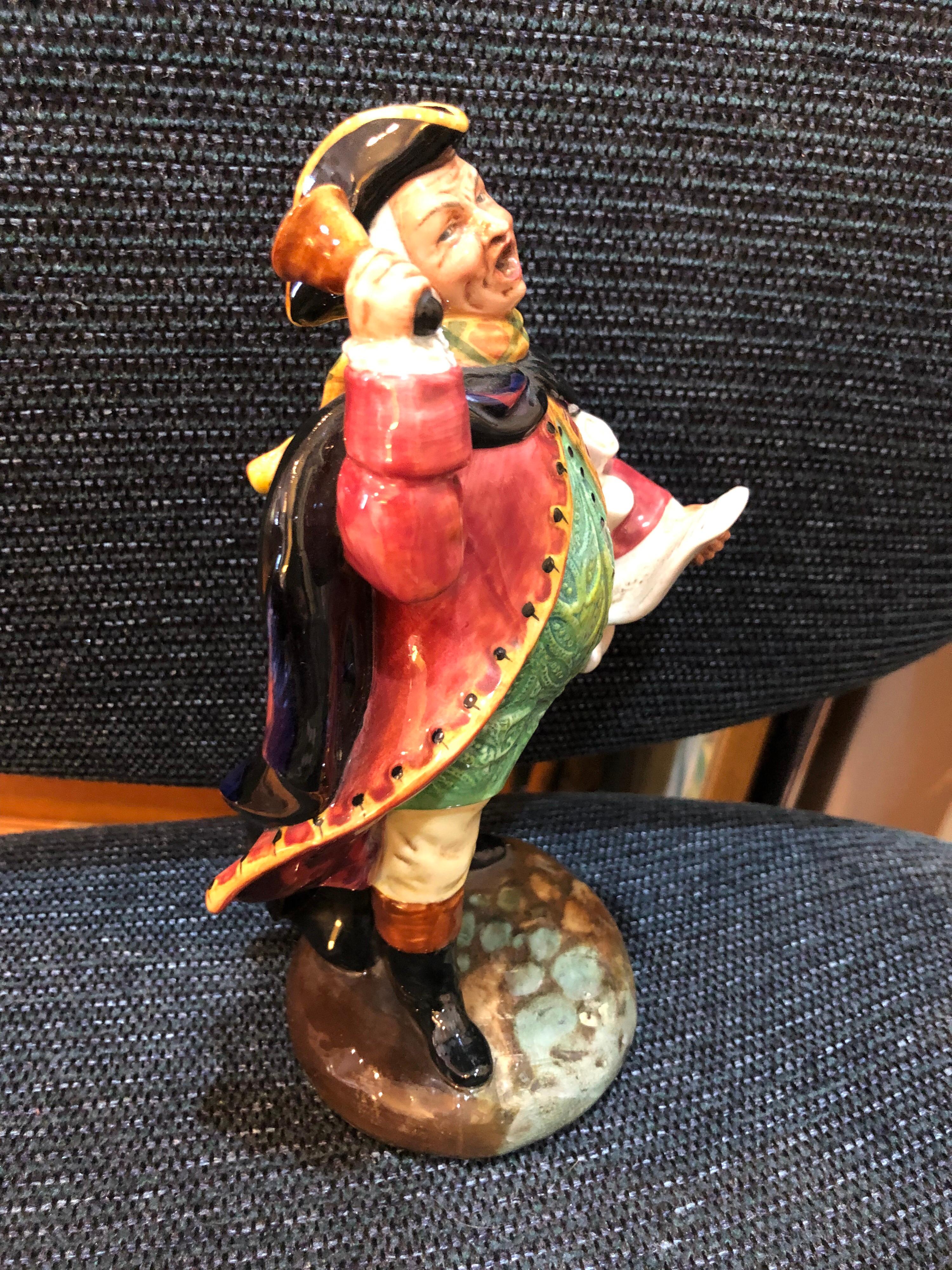 Royal Daulton figurine of a Town Crier. Amazing colors and glaze to this exceptional piece. Perfect addiction to your collection of Royal Daulton figurines.