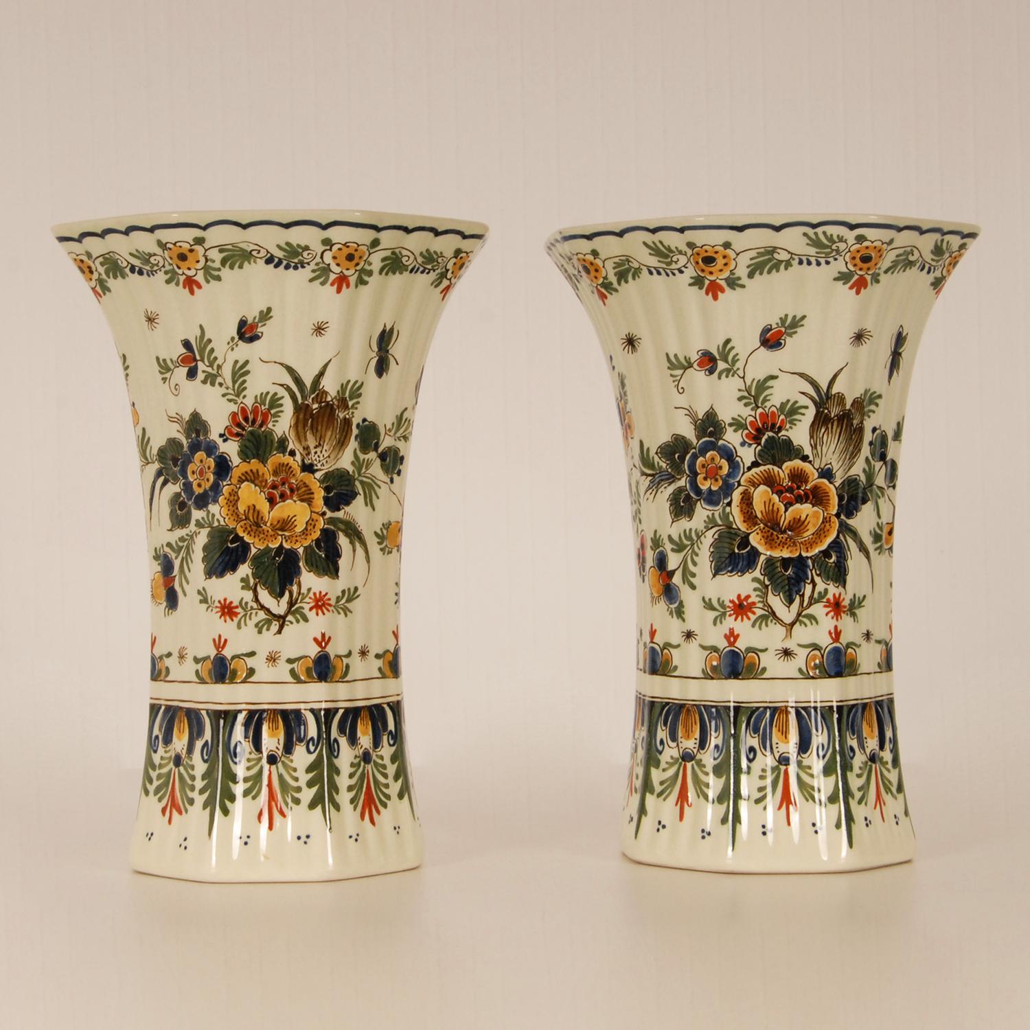 Dutch Royal Delft Polychrome Delft vases
A pair Delftware beaker vases
The vases are hand crafted and hand painted in enchanting colors
Floral decoration Chinoiserie with birds and flower basket
Origin The Netherlands, Delft 20th