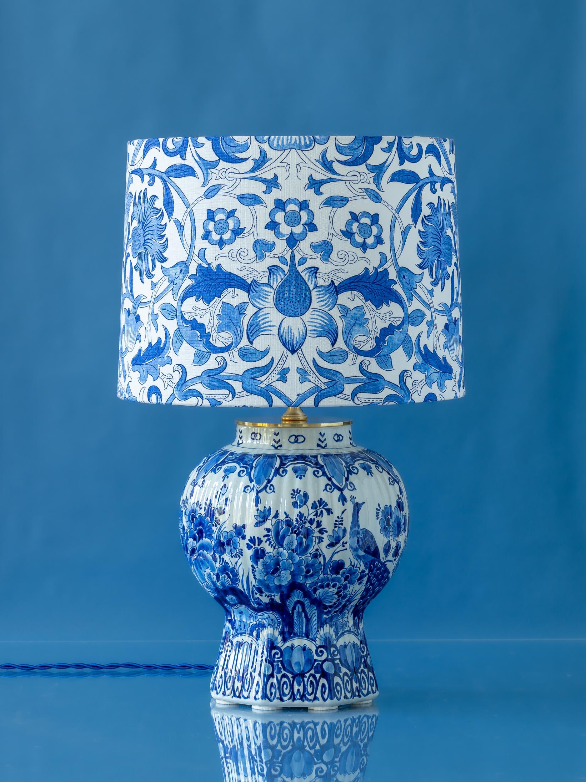 Meet Lodden a one-of-a-kind lamp lovingly handcrafted from a gorgeous, vintage, hand-painted Royal Delfts (De Proceleyne Fles) Delft Blue (Delfts Blauw) vase. The exquisite ribbed vase (or pul), which forms the base of the lamp, was handmade and