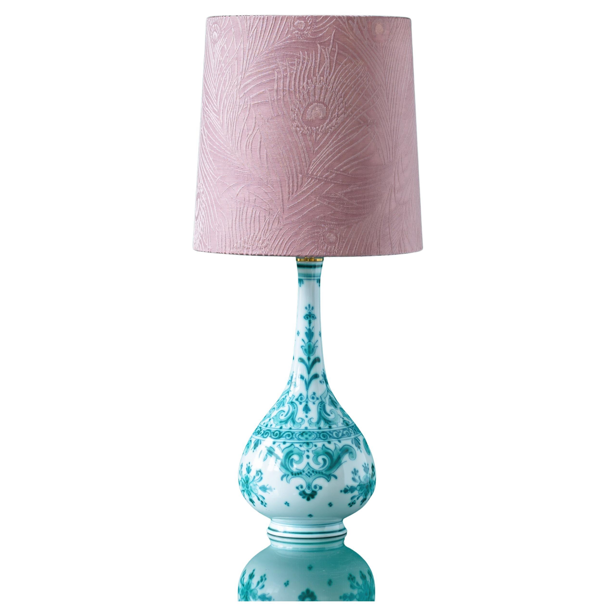 Meticulously handcrafted by Amitābha Studio in Amsterdam, this is a one-of-a-kind table lamp created from a rare vintage Royal Delft (De Porceleyne Fles) Delvert vase. The Delvert series, a striking blend of the French word for green, 