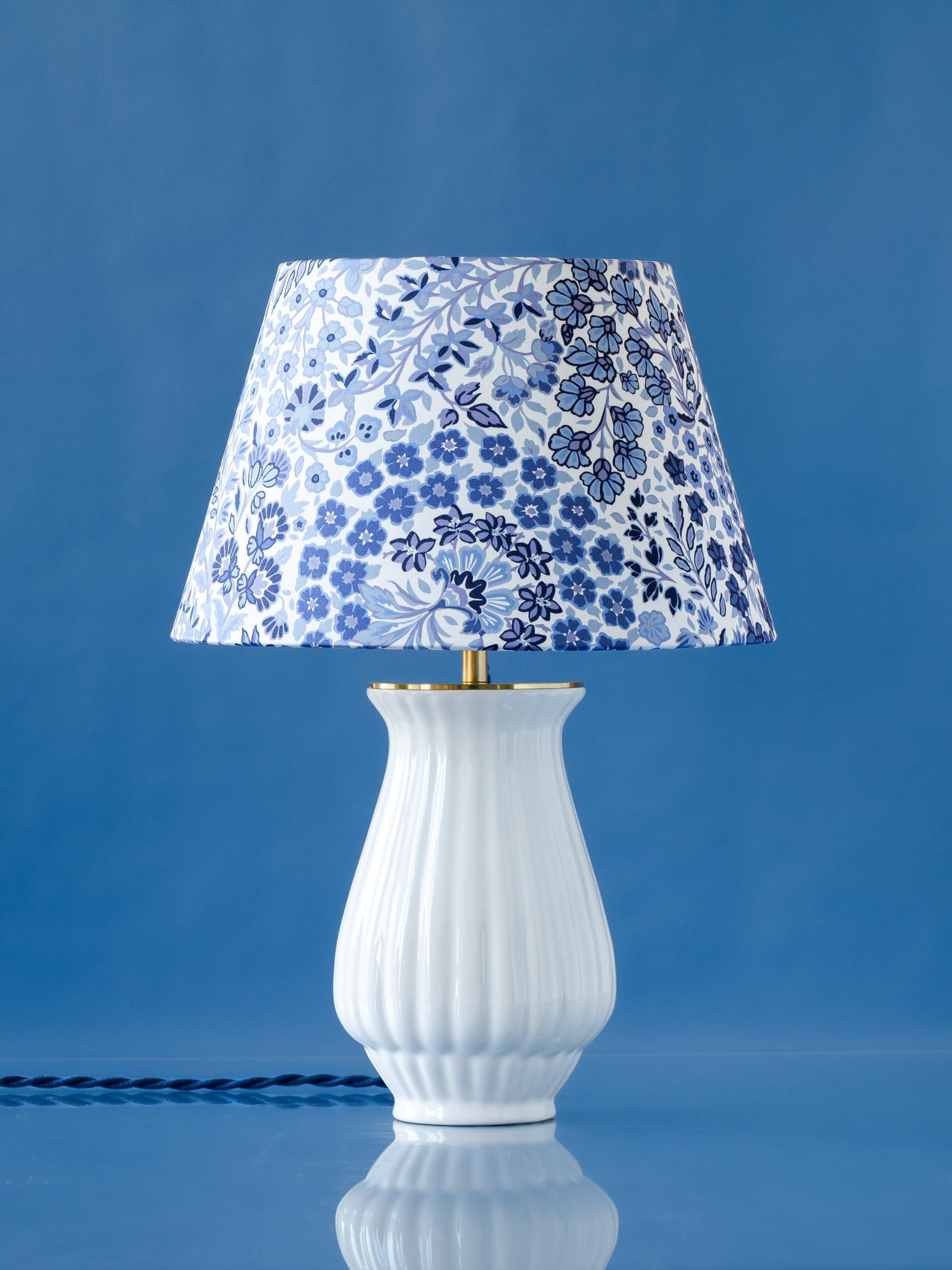 A one-of-a kind lamp, Haven is lovingly handcrafted from a vintage Royal Delft (De Porceleyne Fles) White (Delfts Wit) vase. The uniqueness lies in the shape of the vase and how it catches the light. We’ve paired the delicately ribbed base with a