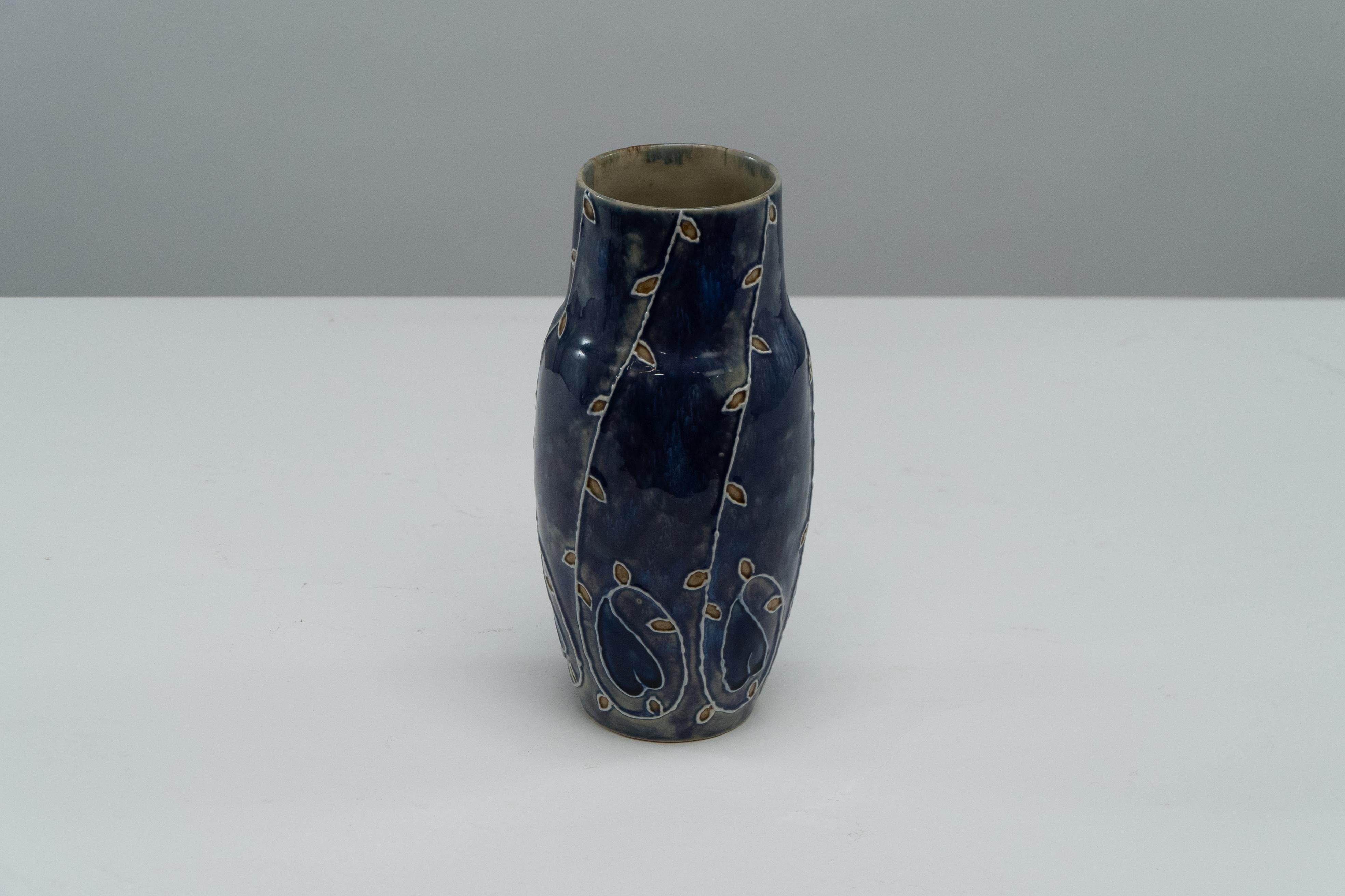 English Royal Daulton signed MB for Mary Butter. Arts & Crafts flowing floral blue vase. For Sale
