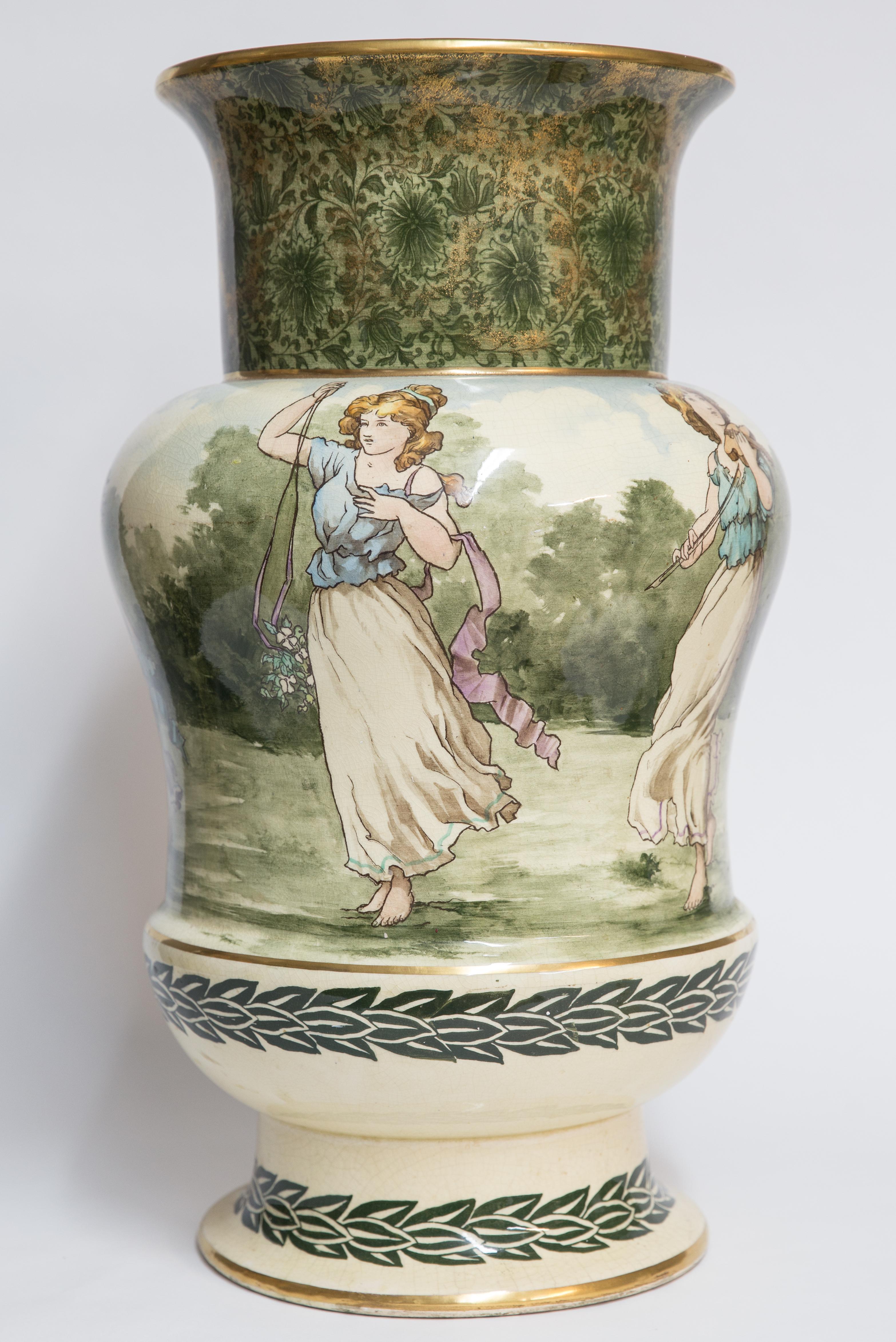 Offered is an exceptional antique turn of the century exhibition size Royal Doulton hand painted vase depicting dancing, frolicking young women. Royal Doulton is an English ceramic manufacturing company producing tableware and collectables, dating