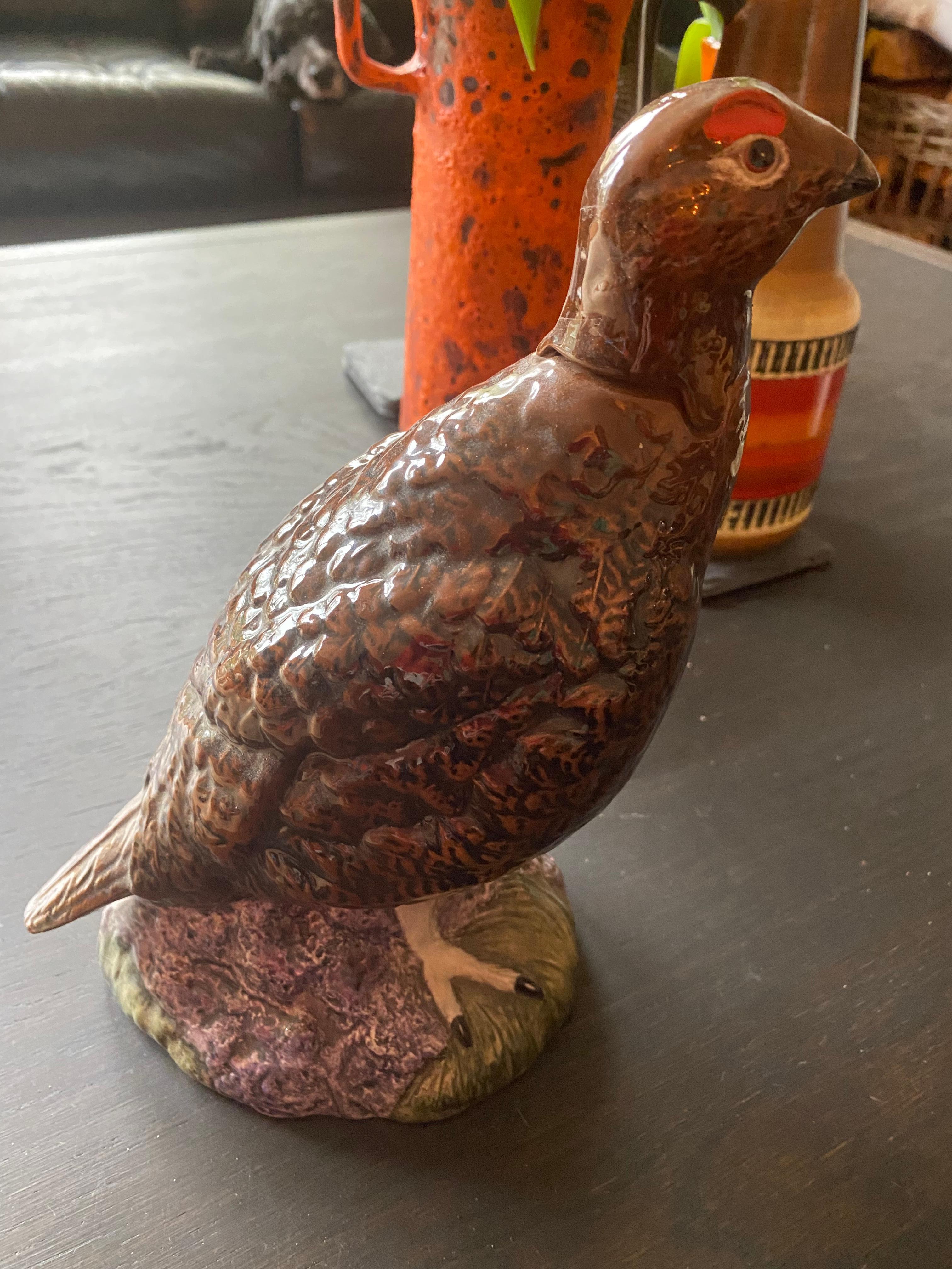 Decanter without the blended Scotch whiskey (sorry!) for Famous Grouse Whiskey by Royal Doulton. It is in a very good condition, no damages.
