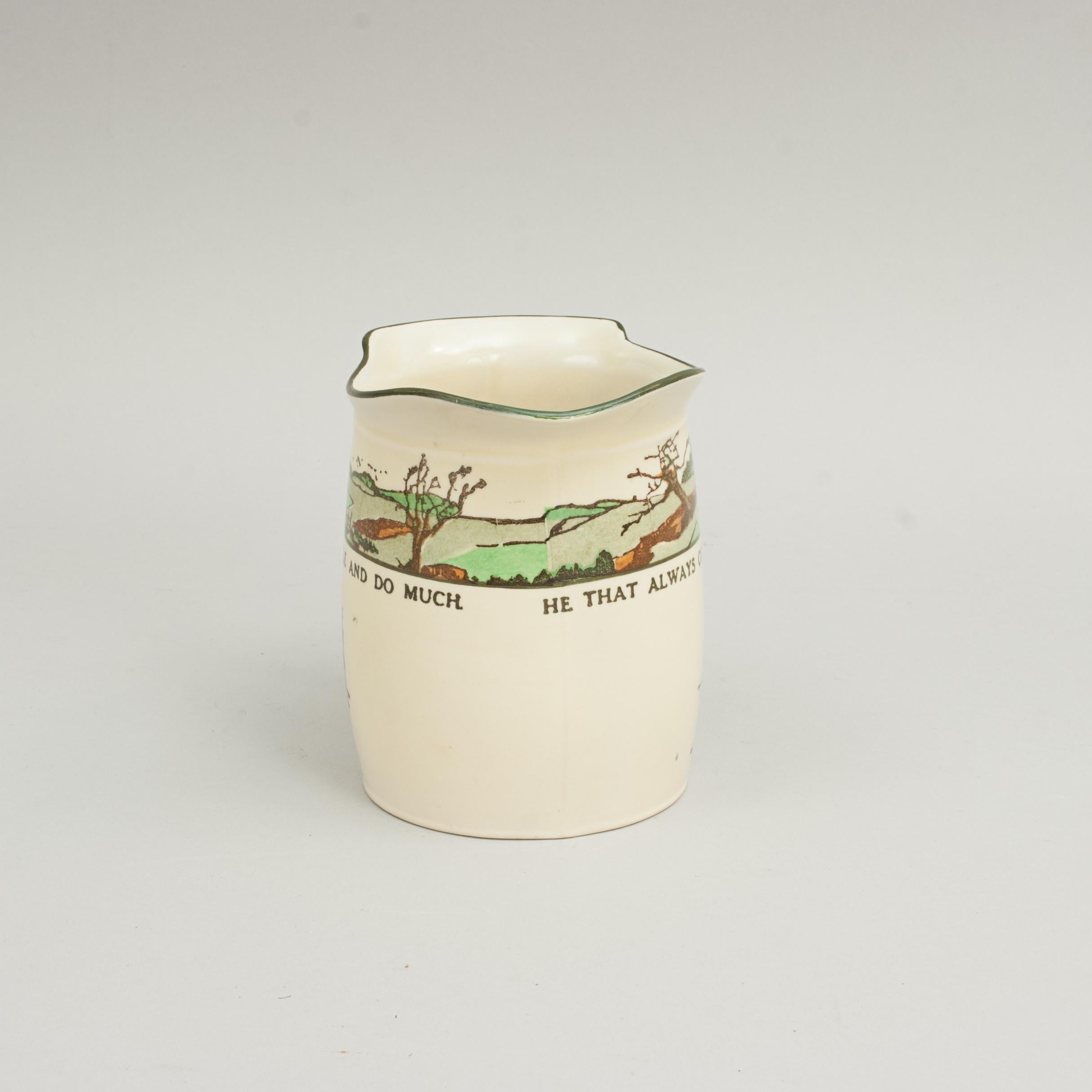 Royal Doulton series ware golf jug.
Royal Doulton jug with polychrome golf scene and the proverb, 