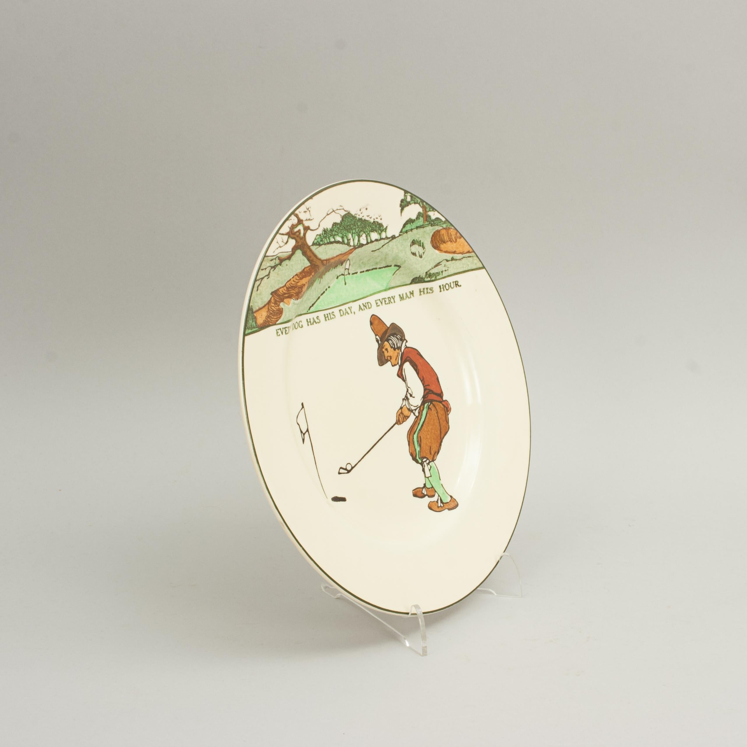 Assiette de golf Royal Doulton Series Ware.
Assiette rack Royal Doulton avec scène de golf polychrome et le proverbe 