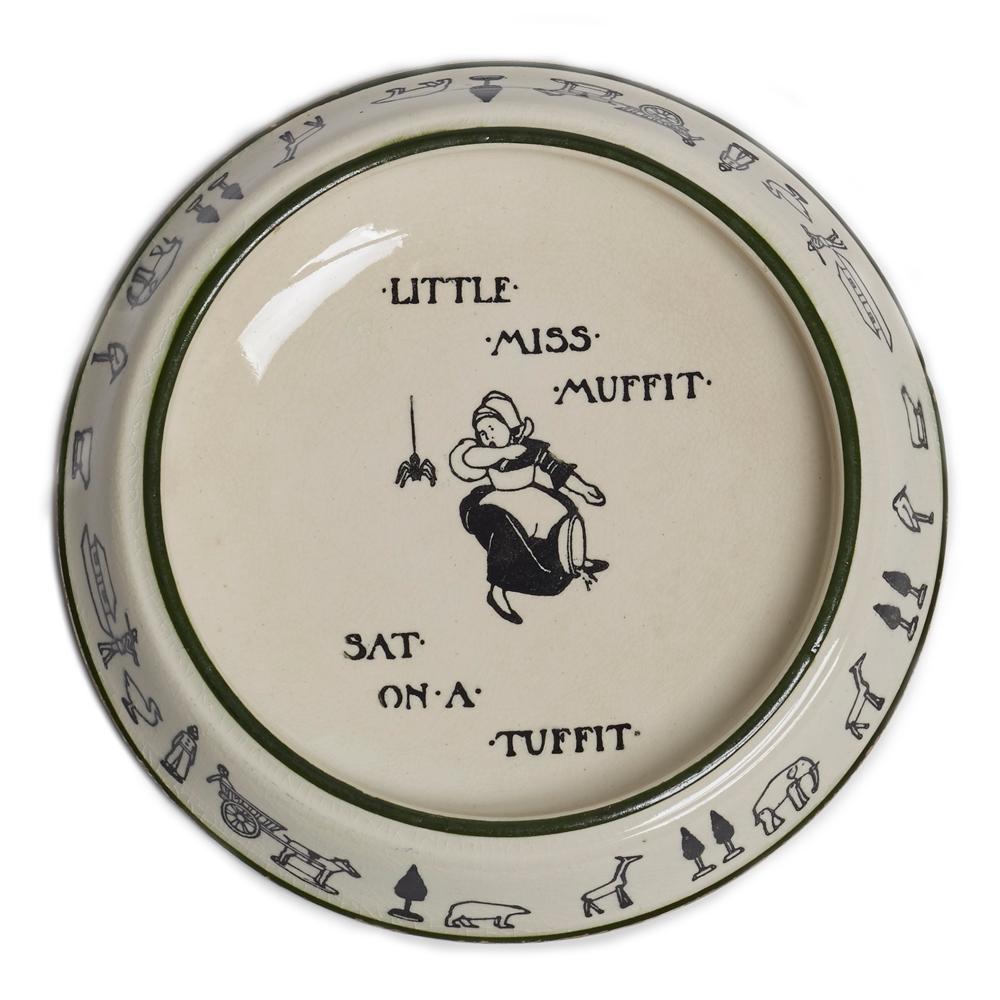 A scarce antique Royal Doulton child's nursery rhyme stoneware dish dating from 1911. The round shallow bowl has a wide rim with raised edge printed with animals, figures, trees and other items in black on a cream ground with a green painted line