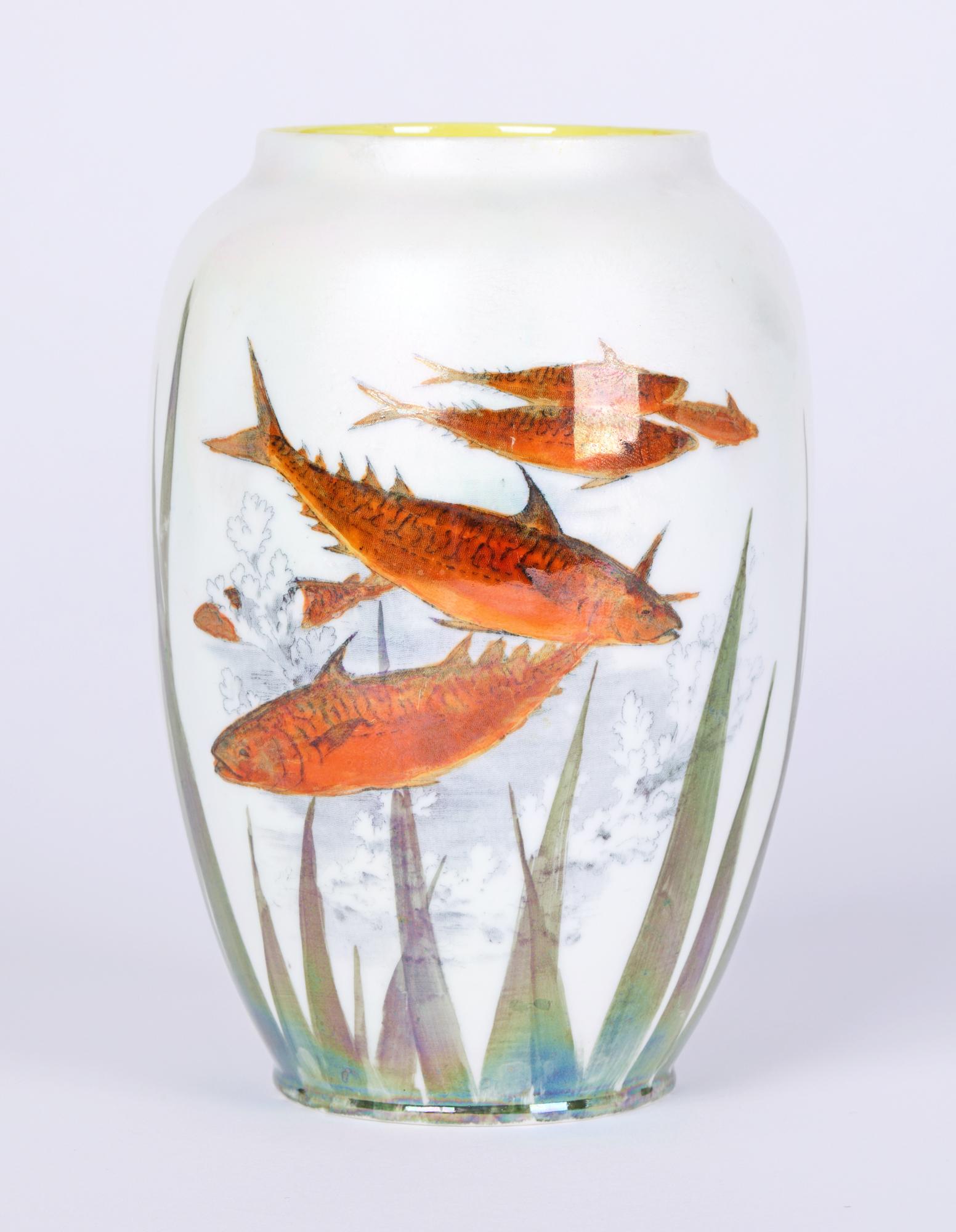 A Royal Doulton Art Deco lustre glazed art pottery vase decorated with fish dating from around 1920. The vase made in porcelain is of tall round bulbous shape the body decorated with gold colored fish amidst pond weed. Decorated in orange and green
