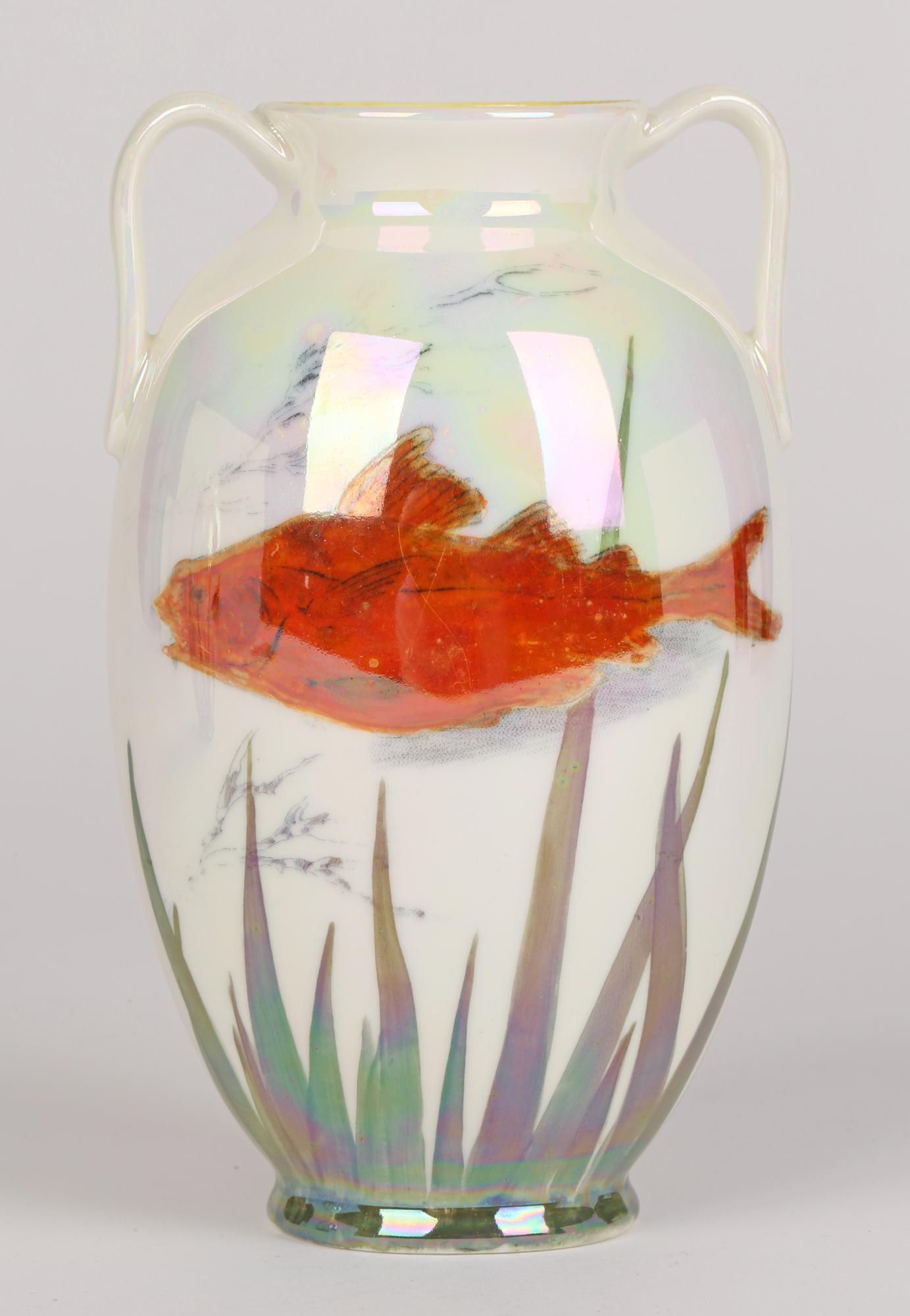 A Royal Doulton Art Deco pair twin handled lustre glazed art pottery vases decorated with fish dating from 1920. The oval bodied vases have printed marks to the base along with what is believed to be painted style and artist marks.

In good