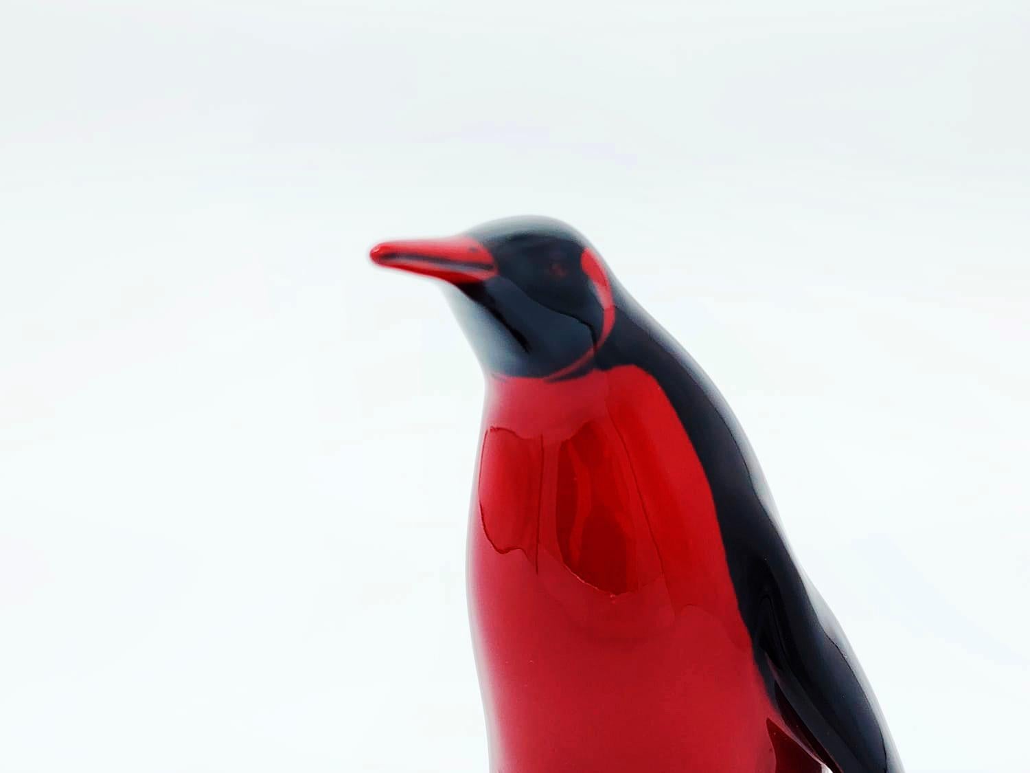 Royal Doulton Porcelain Figure made in England.
Emperor Penguin Figure in Red and Black Flambe
Measures:
Height: 15 centimeters
Length: 6.5 centimeters
Depth: 7 centimeters