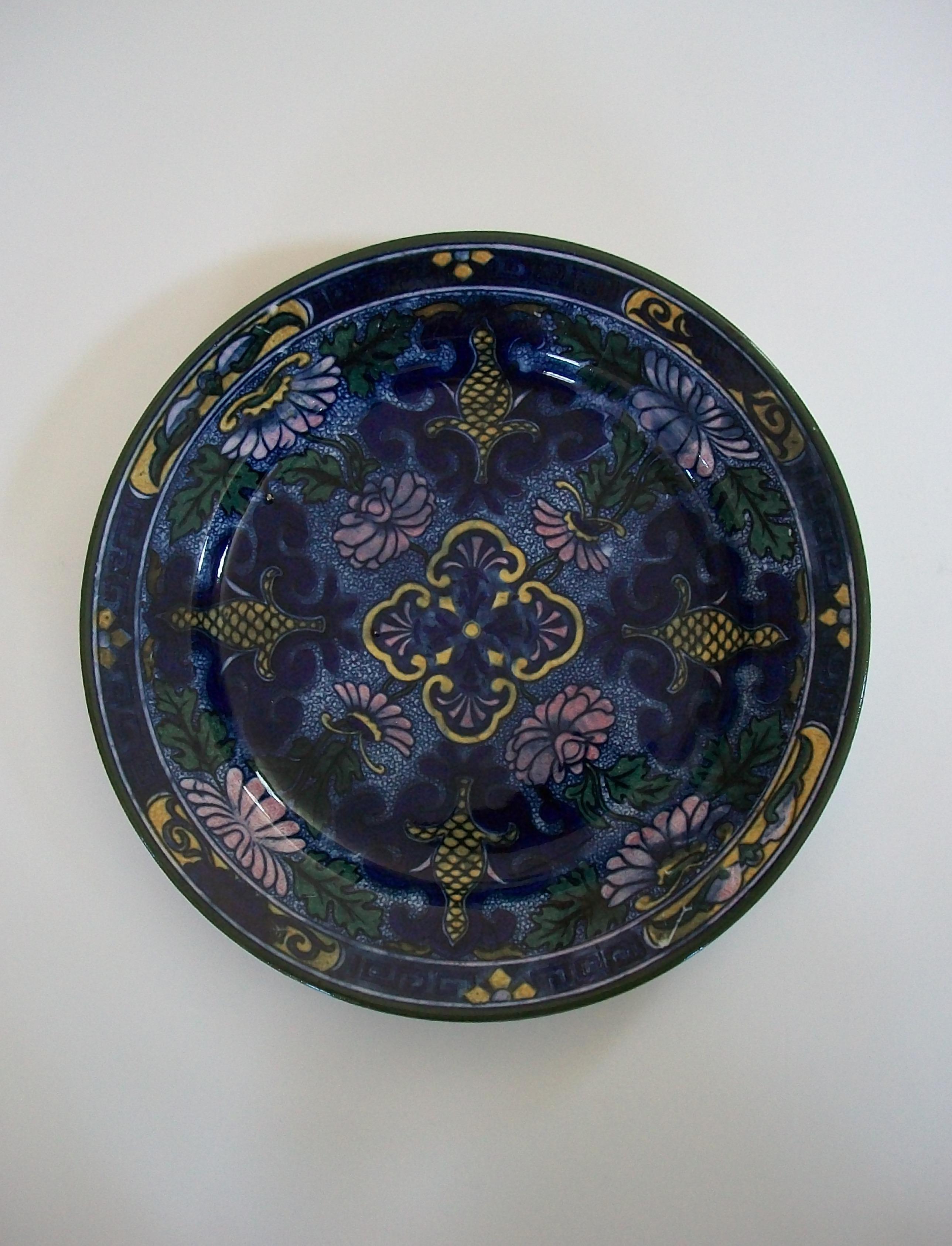 ROYAL DOULTON (Manufacturer) - Persian D3088 (Pattern Name/Number) - Persian style transfer decorated ceramic cabinet plate in blue with hand painted highlights - featuring flowers within a single line border - signed on the back (back stamp) -