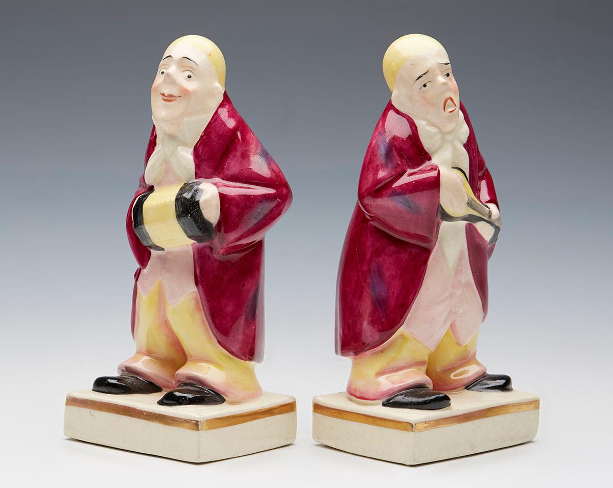 An unusual and very rare pair Royal Doulton novelty figural bookends modeled as musicians dating from around 1920. The ceramic bookends portray two novelty figures of men dressed in oversized clothing with blond hair, one playing a squeeze box and
