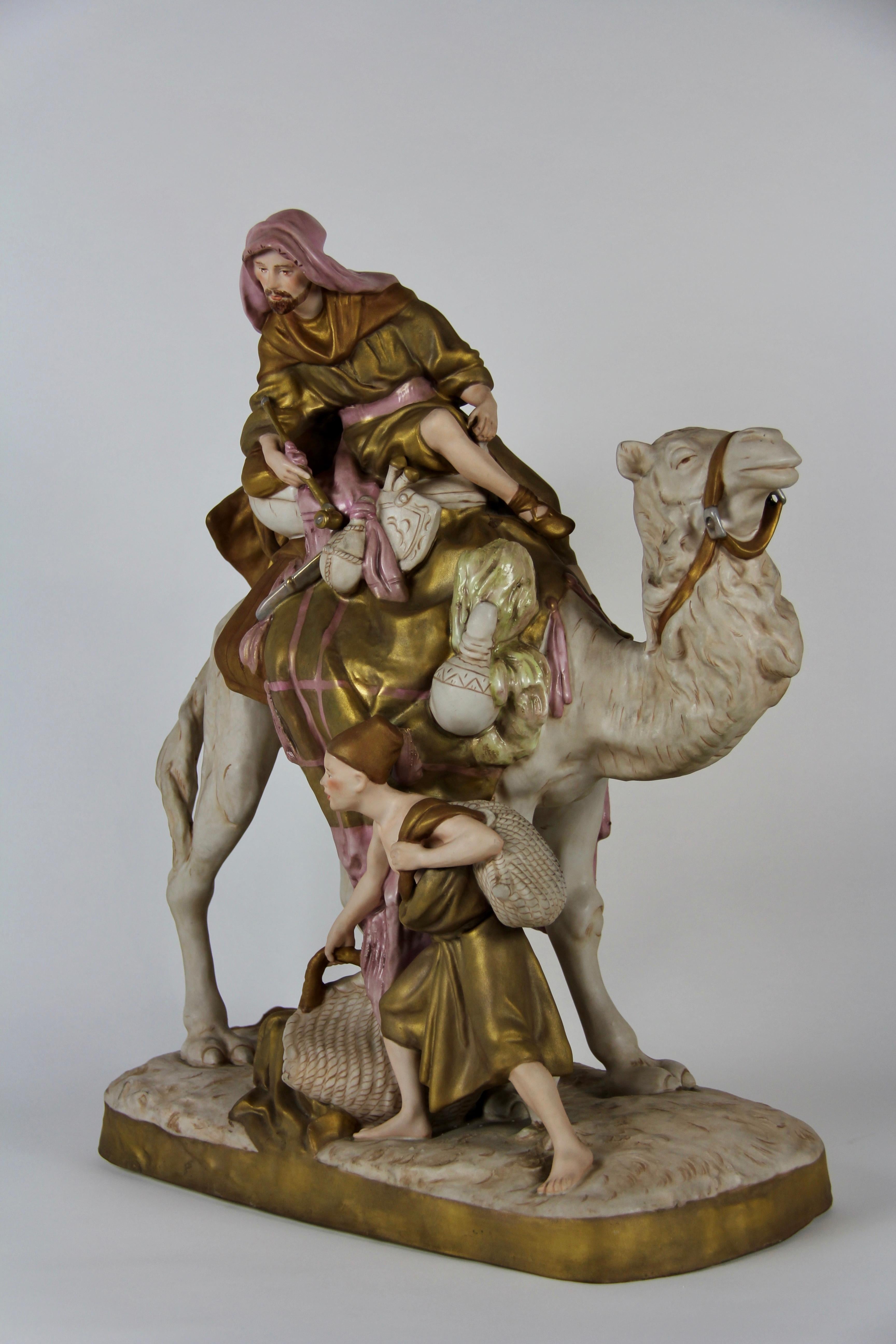 Tchèque Groupe en porcelaine Royal Dux représentant un bédouin à dos de chameau avec son assistant en vente