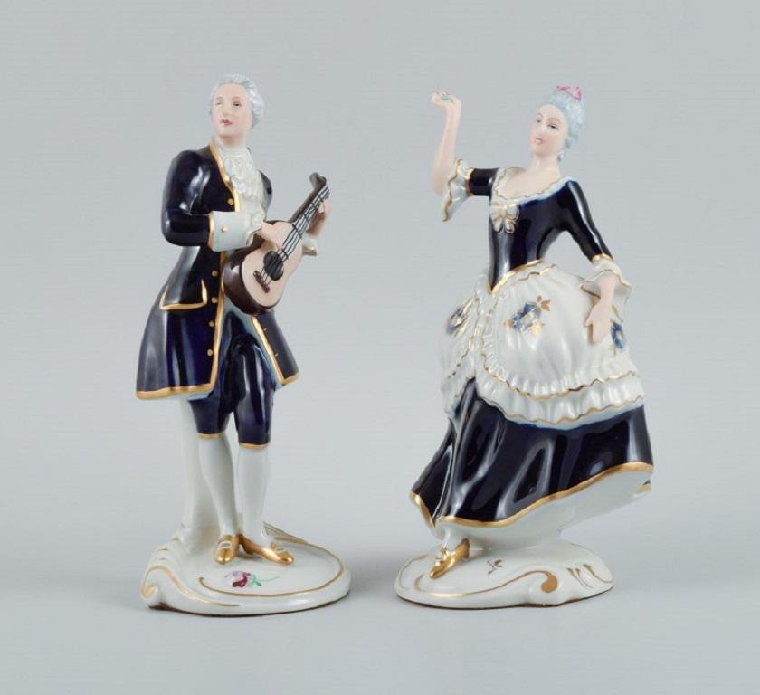 Königlicher Dux. Rokoko-Paar aus handbemaltem Porzellan.
1940s.
Markiert.
Perfekter Zustand.
Die Frau misst: 21,0 x 13,0 cm.
Der Mann misst: 22,0 x 9,0 cm.

