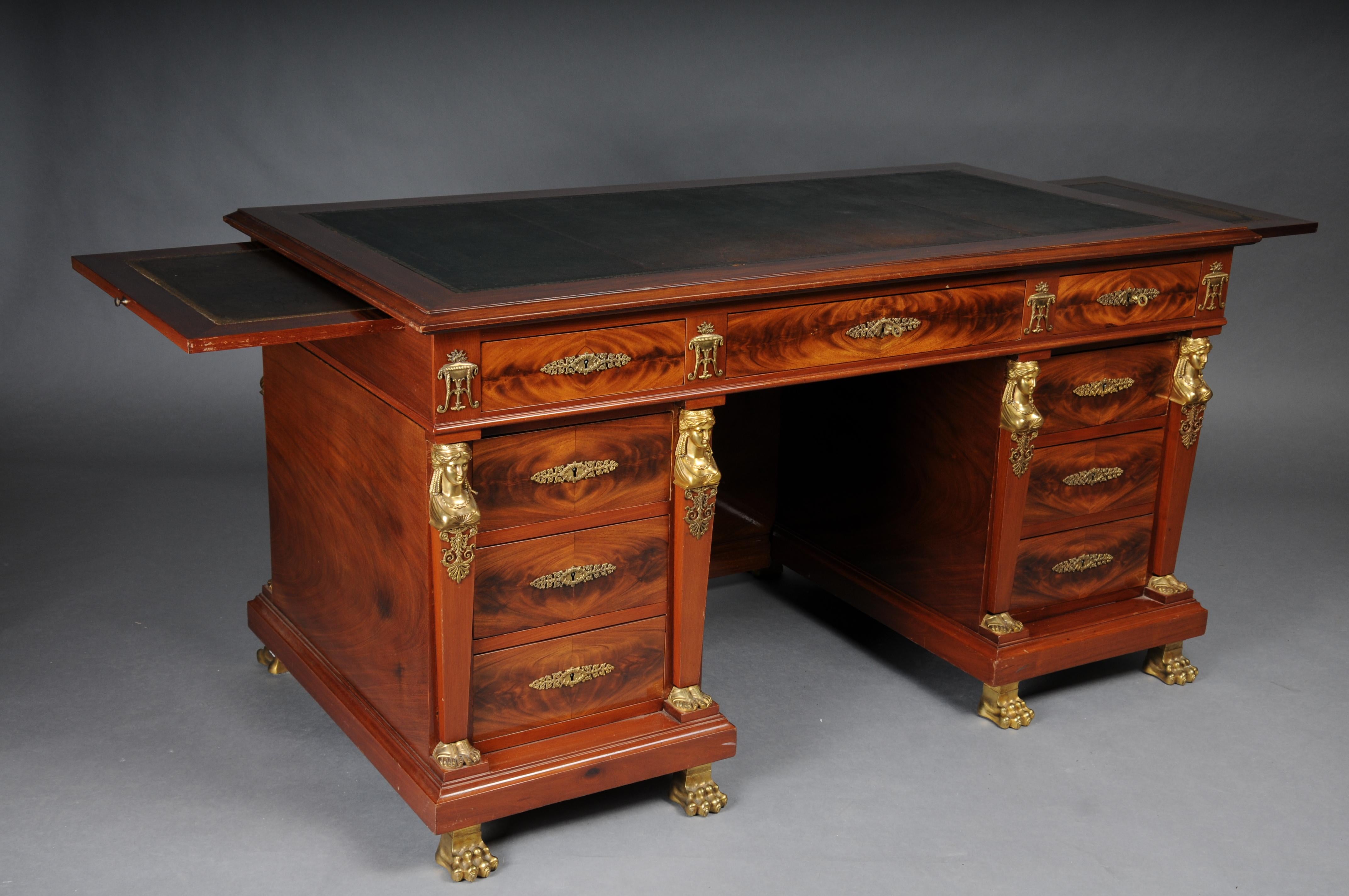 Royal Empire Desk/Bureau Plat, Gilt Bronze

Mahogany with gilded bronze fittings in the form of female figures, incense burners, acanthus decoration and garlands.
Rectangular plate with green leather inlay embossed with gold. Writing tablets that