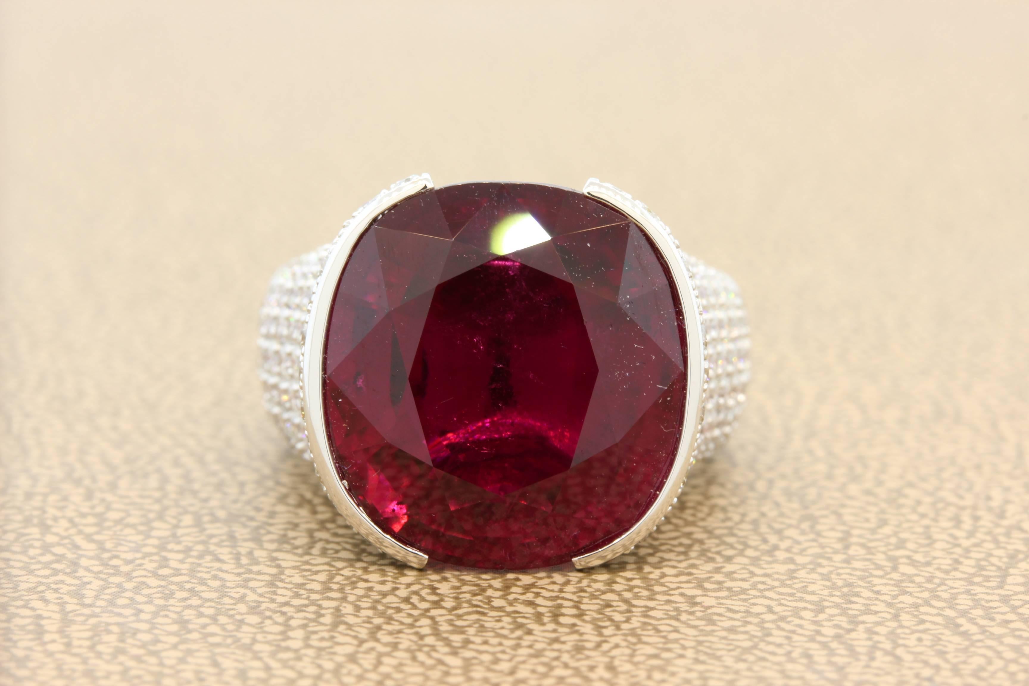 The word Gem is often used carelessly when describing a stone. In this case we feel very confident to describe this deeply saturated raspberry red 18.10 carat rubellite as a royal gem. 
The saturation of color is amazing along with the transparency