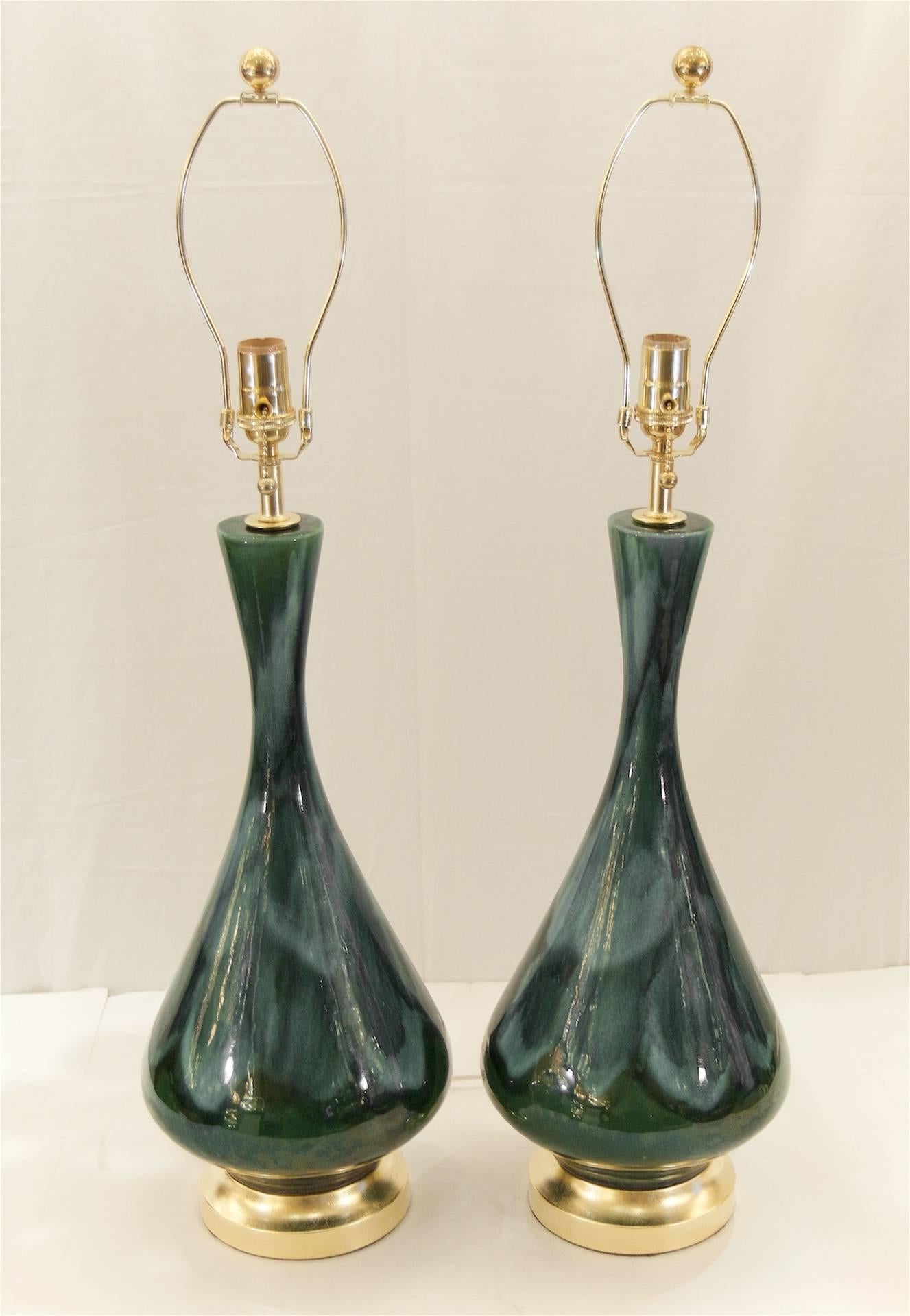 Excellent pair of Royal Haeger blue and green tones drip glaze table lamps; unusually deep and variegated glaze for this iconic design. Hardware newly gilt.

New wiring and sockets.

Measure: Height listed is with 9