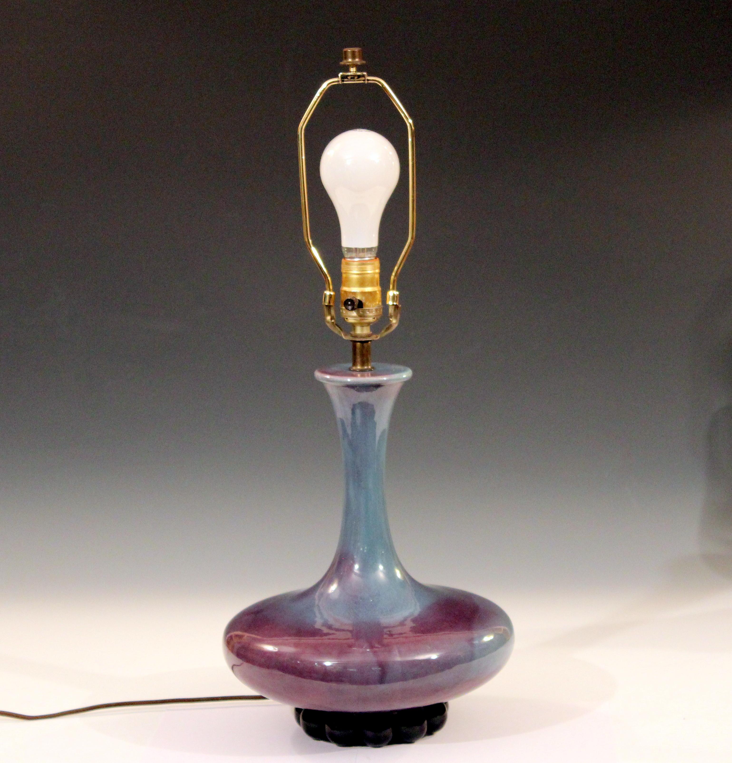 Vintage Art Deco Royal Haeger lamp in Chinese inspired form with blue/purple flambe glaze on black ball bearing base, circa 1950s-1960s. Measures: 24