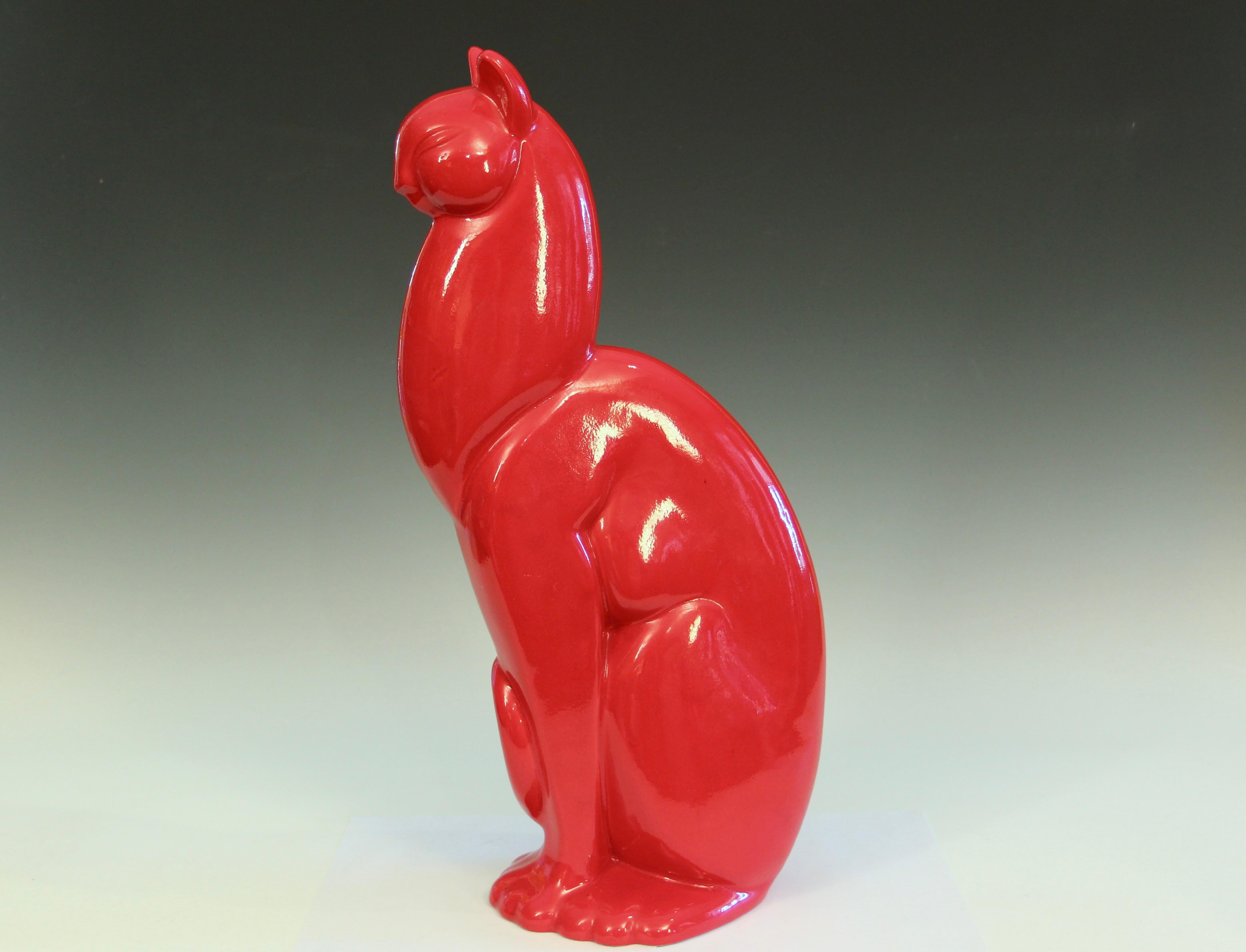 Large Haeger cat in deep red glaze, circa 1960's. 20 1/2” high. Small glaze flaw on back, as shown.