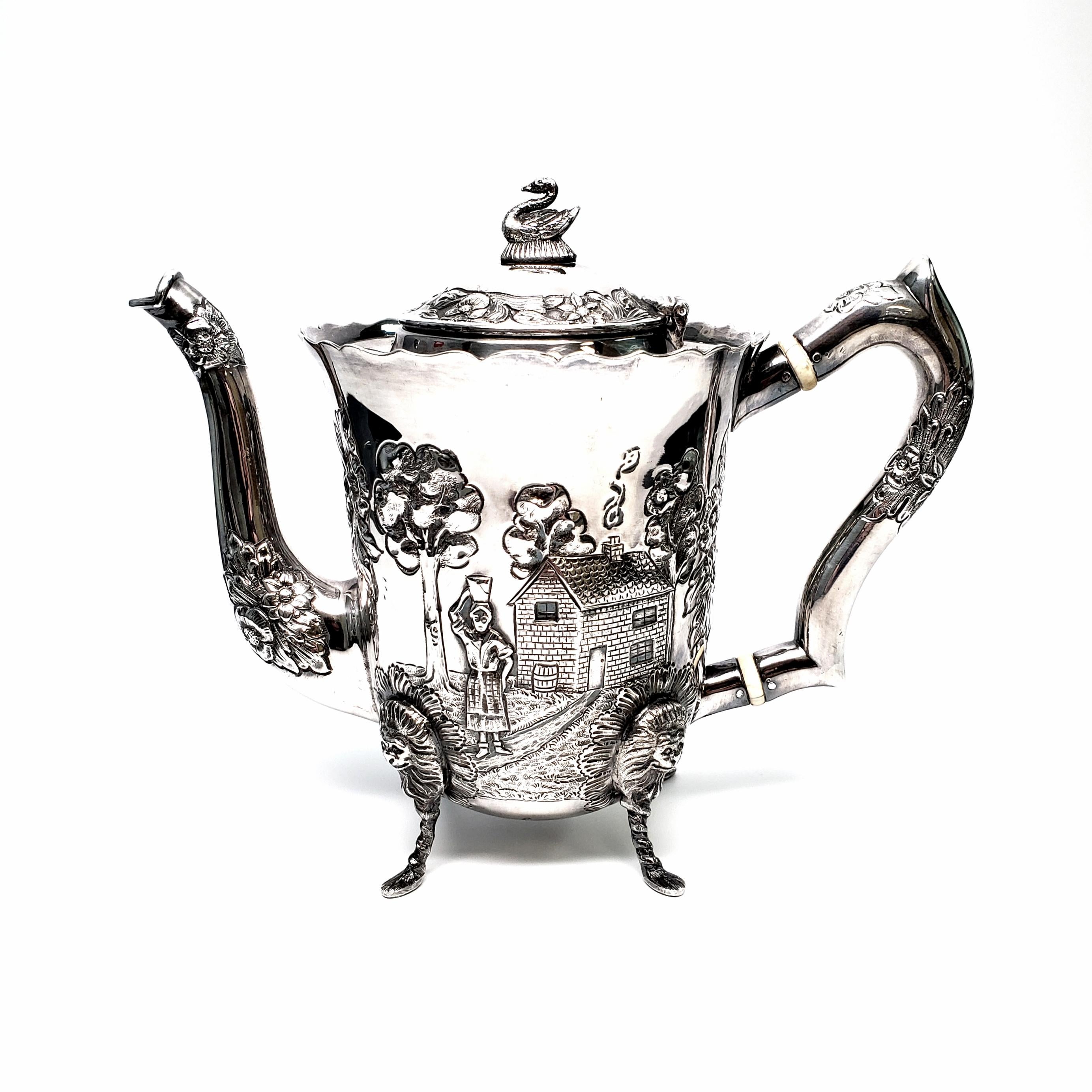 Vintage sterling silver 4 piece coffee and tea set in the Dairymaid pattern from Royal Irish Silver Co, circa 1968.

The 4 pieces of this beautiful set include a tall coffee pot, a shorter tea pot, an open creamer and a sugar bowl. The chased and