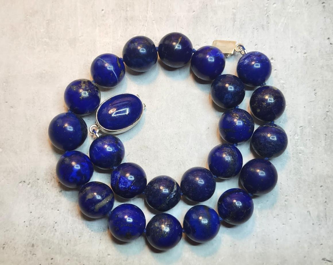 The necklace is 19 inches (48 cm) long, and the smooth round beads are 18 -19 mm in size.
Lapis lazuli is treasured the world over for its beautiful deep blue color. It is highly saturated and variously described as indigo, royal, midnight, or