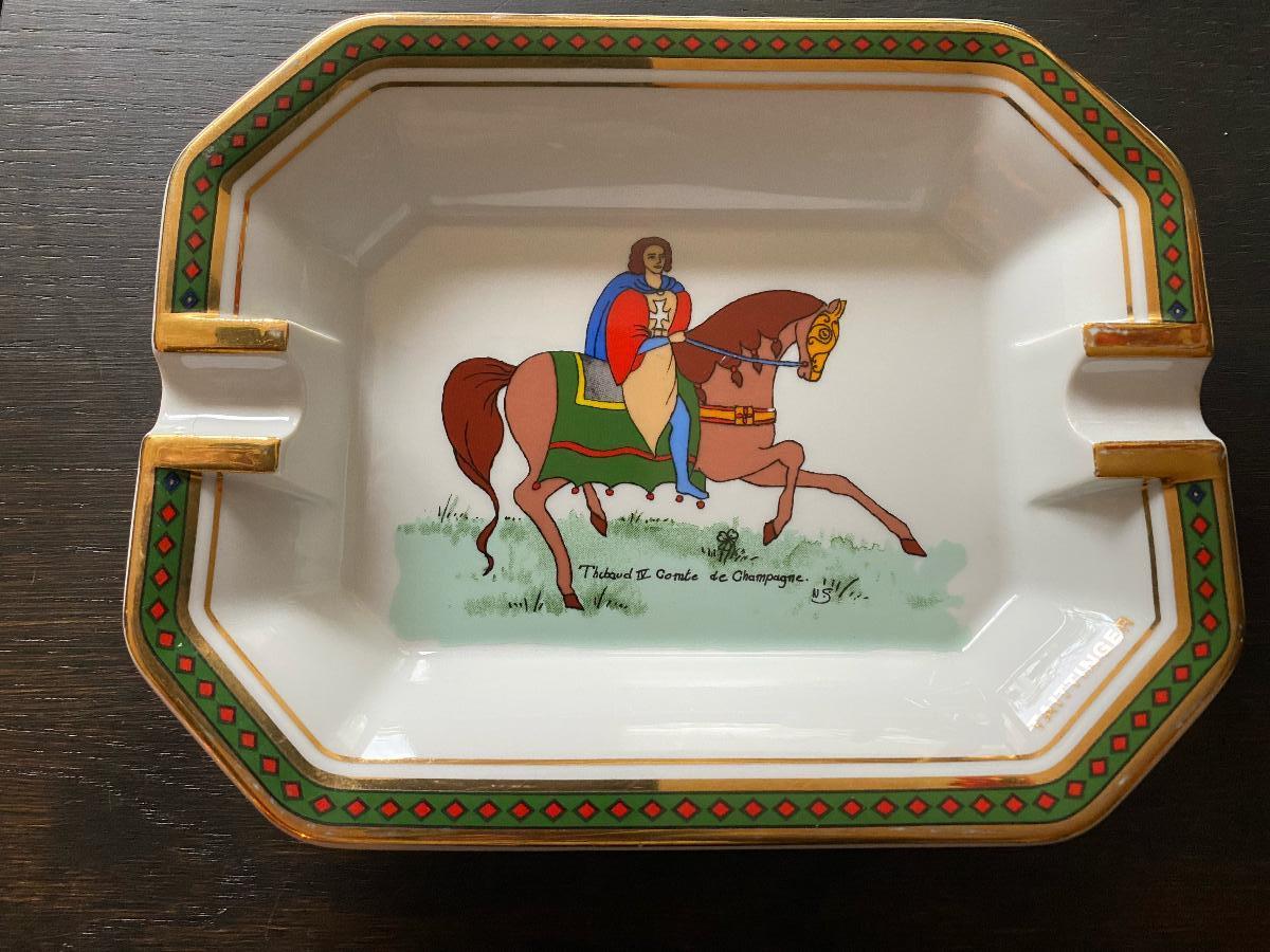 Beautiful porcelain ashtray, made for Taittinger Champagne by Royal Limoges, France. Royal Limoges was founded in 1797, and is the oldest porcelain factory still in operation.
The ashtray features an image of Count Thibaud IV de Champagne, King of