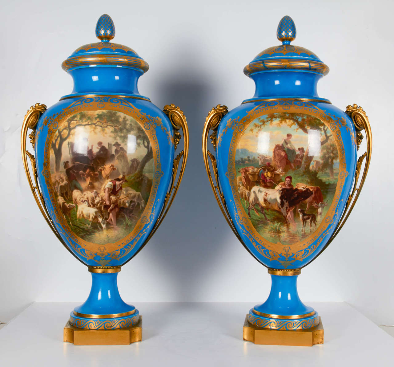 A large pair of ormolu-mounted Se`vres Porcelain Bleu Celeste '1867 Exhibition' vases and covers (‘Vase Paris de Milieu Garnis’), ‘l’Abreuvoir’ and ‘Le Retour’ De Champs’
1860, one cover incised 69 and 5, the gilding by E.F. Blanchard, the painting