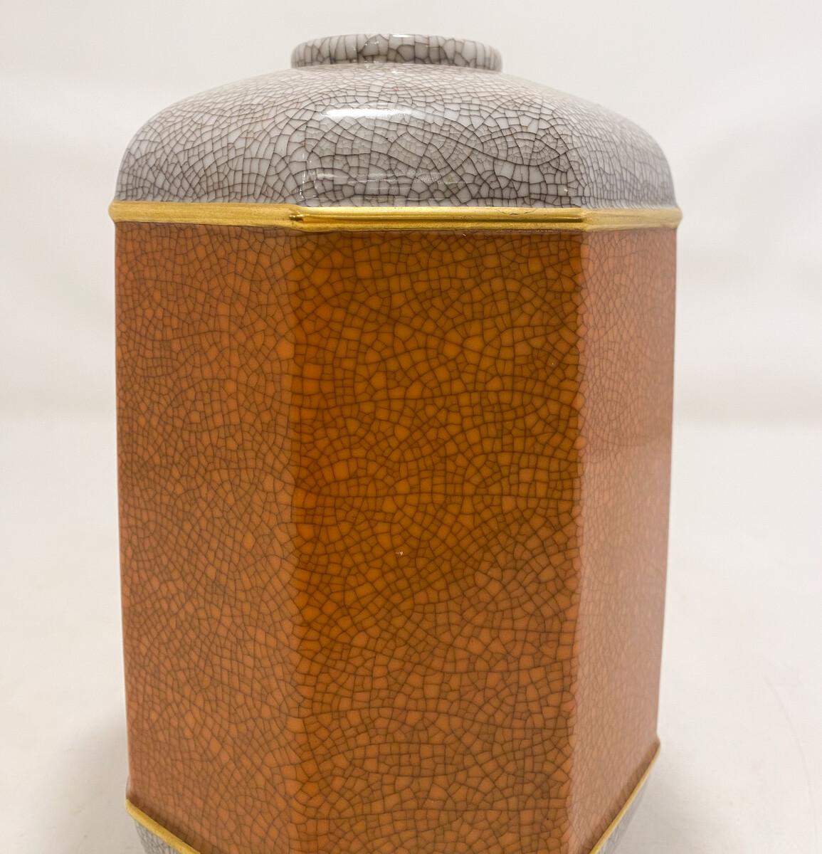 Royal porcelain, Bing & Grøndahl; craquele vase in lightgrey, orange and gold, Denmark

Bing & Grøndahl was a Danish porcelain manufacturer founded in 1853 by the sculptor Frederik Vilhelm Grøndahl and merchant brothers Meyer Hermann Bing and Jacob