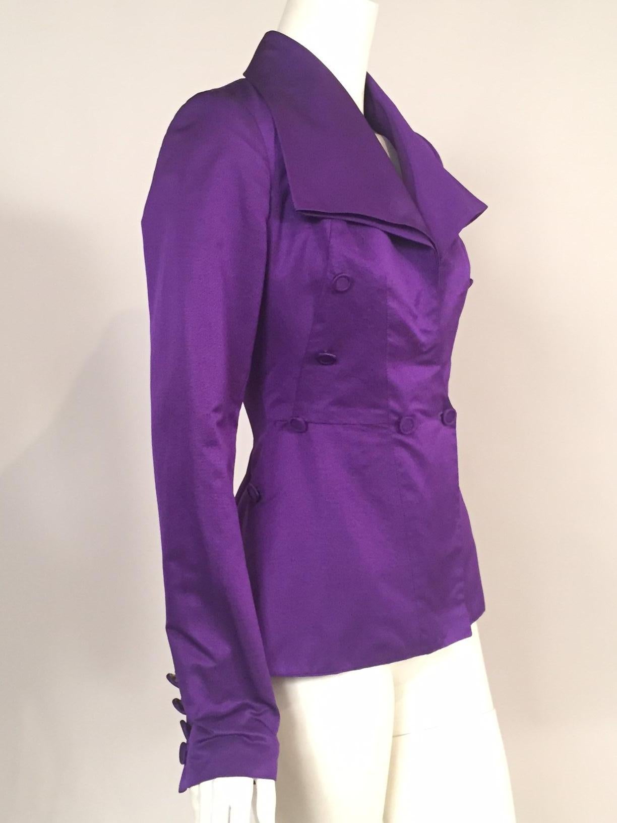 A stunning purple silk faille is used for this Edwardian inspired jacket designed by Maggie Norris for her New York based couture company. The jacket has a generous collar and a single button closure. Covered buttons accentuate bodice darts and the