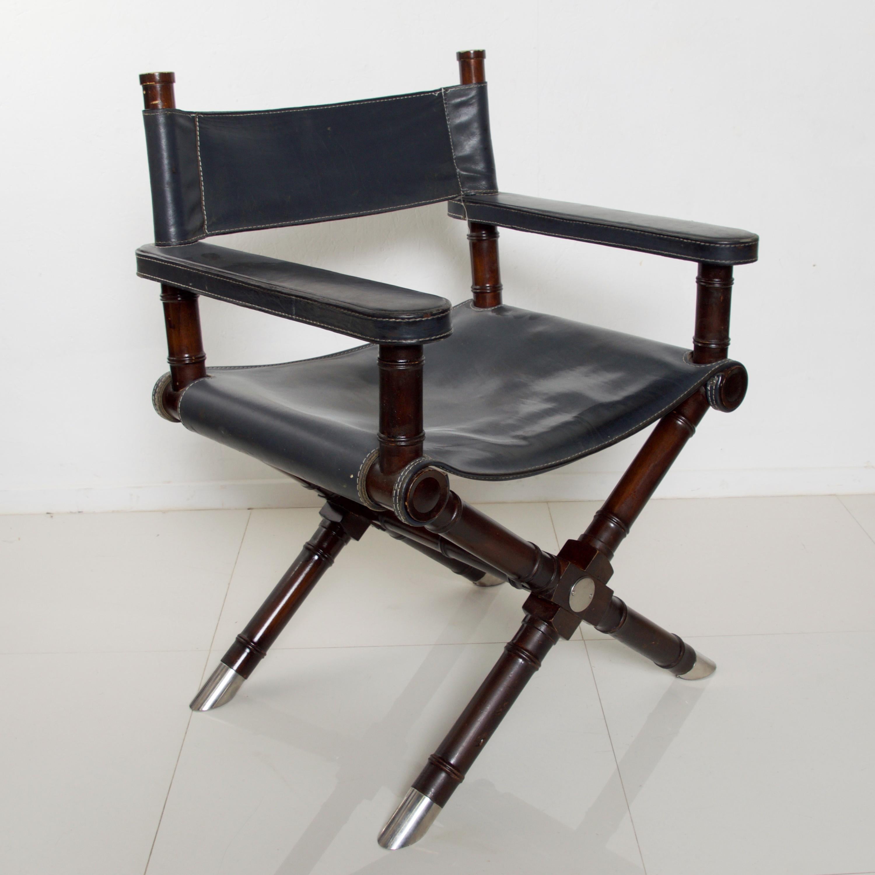 Presenting Ralph Lauren Leather Hollywood Director's Chair Vintage in Classic Navy Blue
Equestrian inspired European Leather Seat on Exotic Rich Wood Cross Braced Mahogany X Frame with Standout Chrome Leg Sabots.
Fabulous comfort and style-a