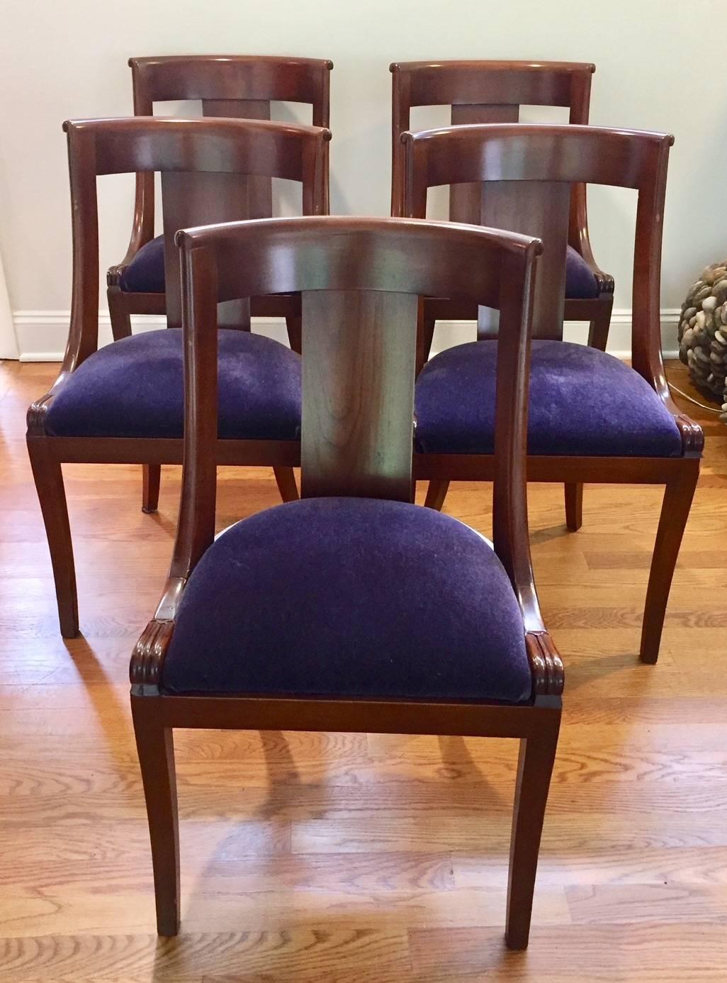 Beautifully elegant 19th century mahogany dining chairs imported from England having lovely simple silhouettes and updated with royal purple mohair seats. A few of the seats are a bit gently used, but we have extra mohair fabric included.