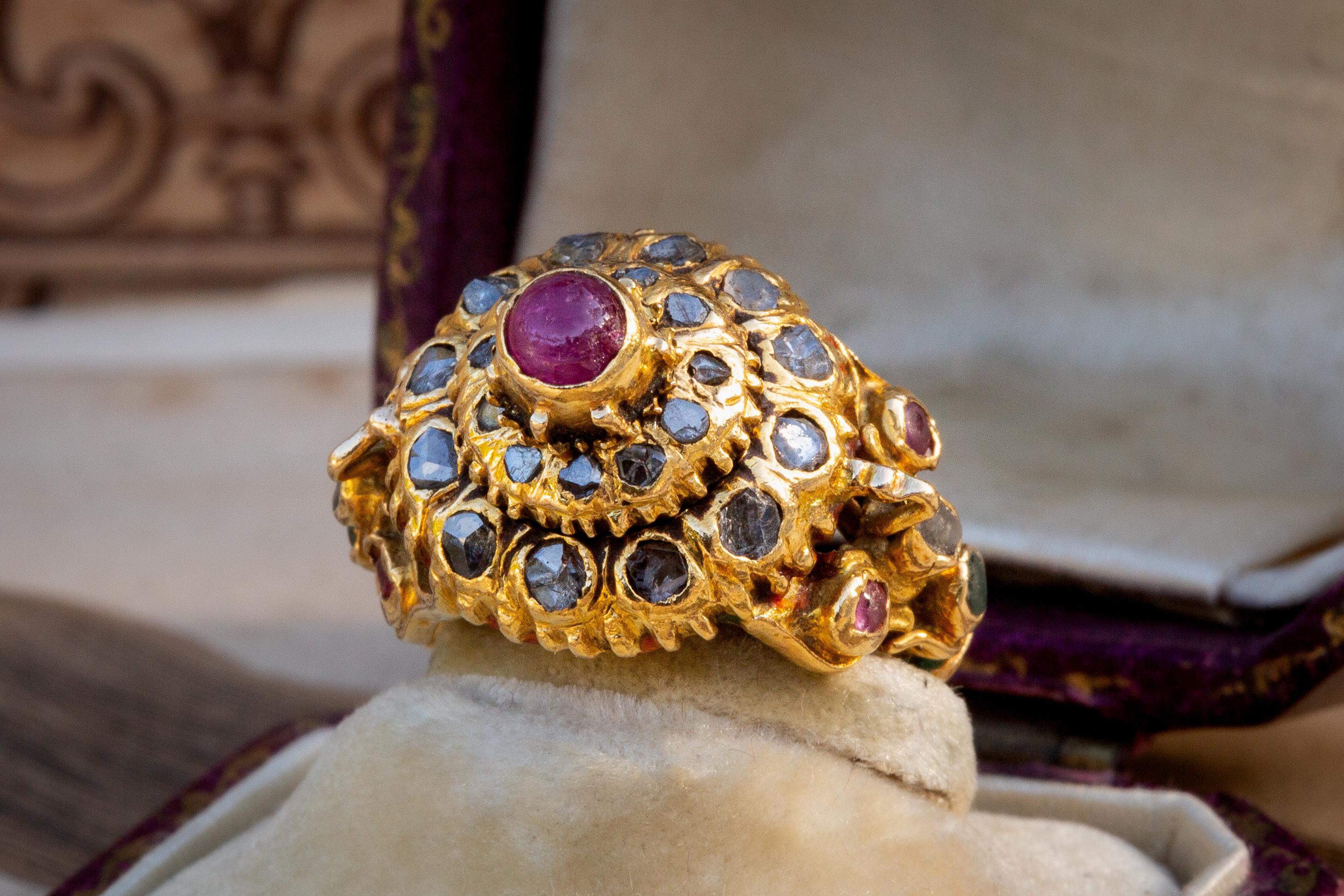 This incredibly ornate piece was made in Siam during the late Ayutthaya or early Rattanakosin Kingdom period. It dates to the late 18th and is a very rare example of a ceremonial ‘mondop’ or ‘pagoda’ ring. 

These rings were made for the monarchy