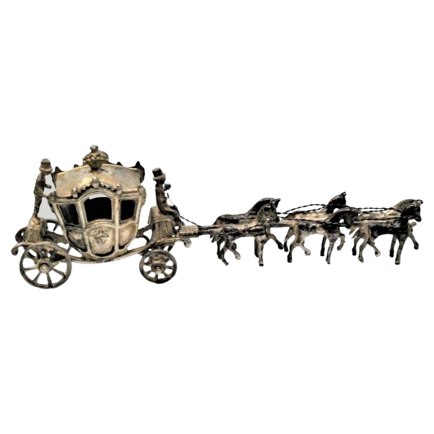 Royal silver coach in 18th century style pulled by four horses