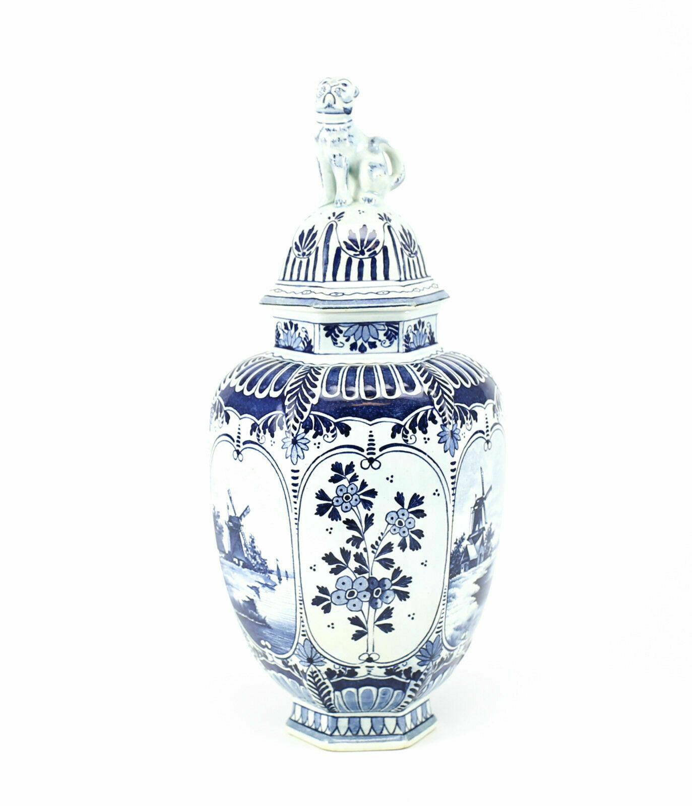 Royal Sphinx Delft hand painted pottery urn with cat finial, 19th century.

Features Classic Blue & White Seascape and Windmill designs. Makers Mark on Reverse.

Additional information:
Features: hand painted 
Production technique: