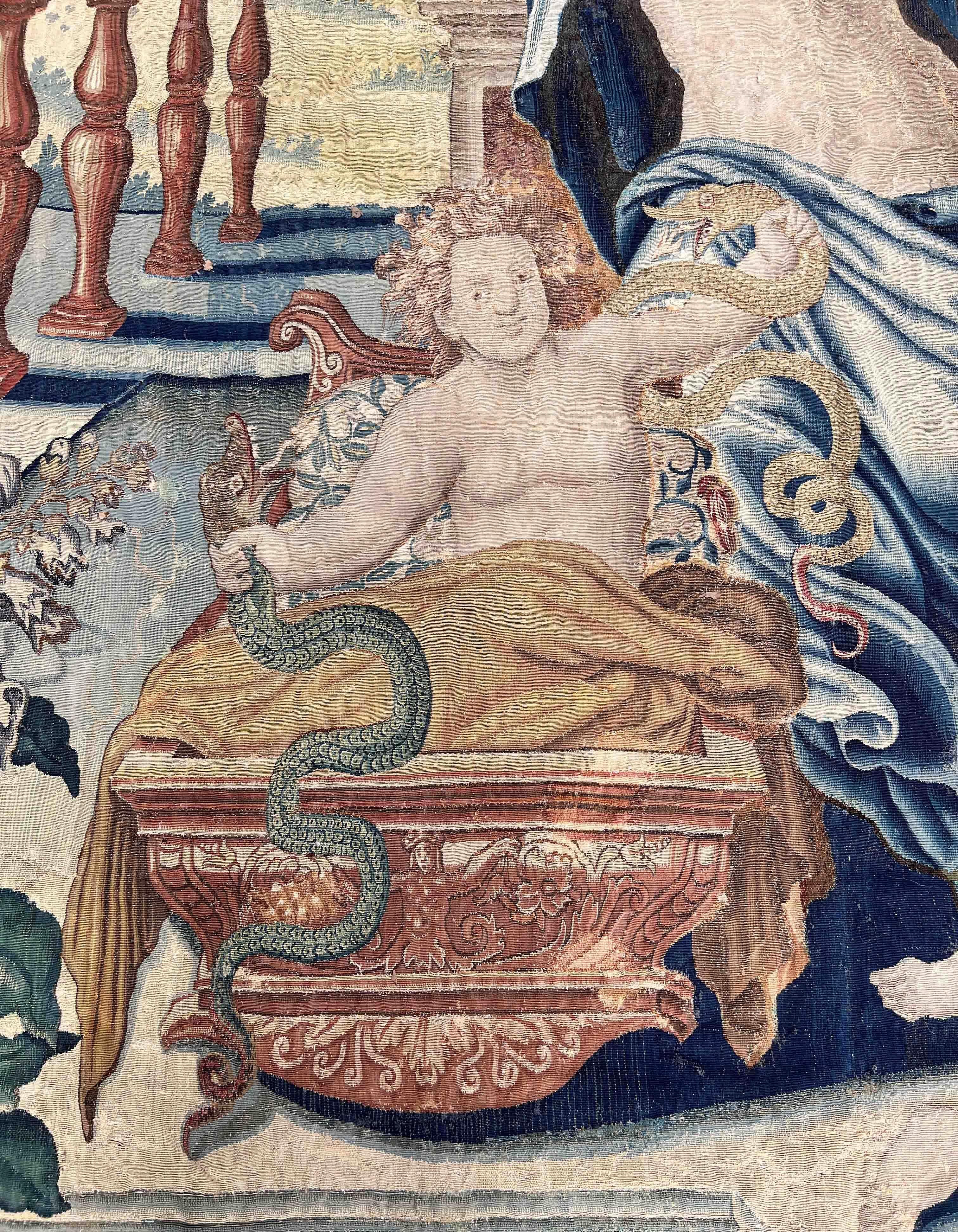Sublime tapestry from the Gobelins factory dating from the 16th century,
Representation of the birth of Hercules, a famous character from Roman mythology. Hercules holds two snakes in his hands like toys. His parents are next to his cradle as well