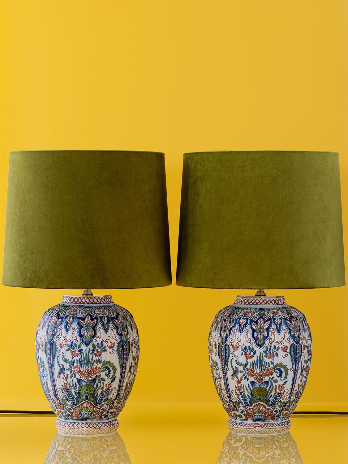 Meticulously handcrafted by Amitābha Studio in Amsterdam, Olive and Moss are a pair of unique table lamps made from vintage Royal Tichelaar Makkum Delft vases. Hand-painted by a master artisan between 1940 and 1979, these vases showcase exquisite